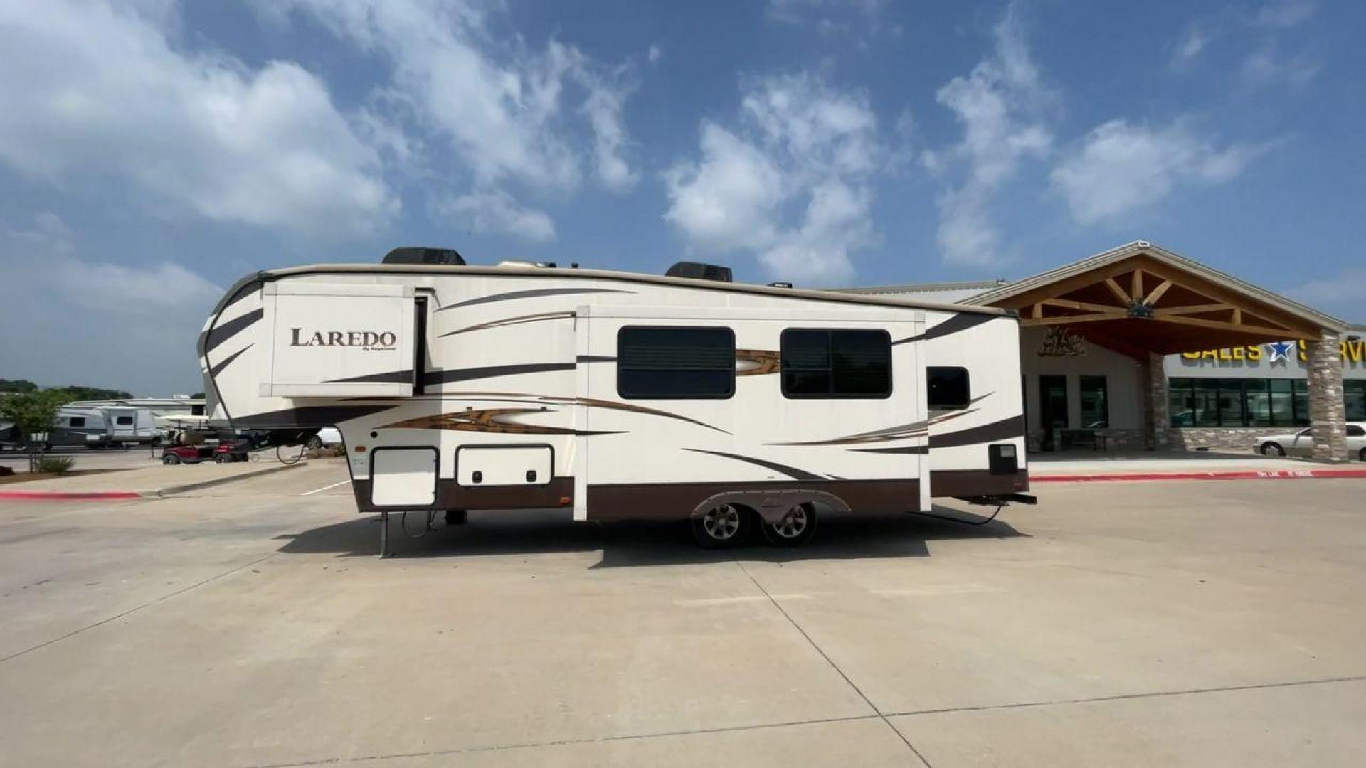 2015 WHITE KEYSTONE LAREDO 285SBH (4YDF28522FK) , Length: 33 ft. | Dry Weight: 7,880 lbs. | Gross Weight: 9,580 lbs. | Slides: 1 transmission, located at 4319 N Main Street, Cleburne, TX, 76033, (817) 221-0660, 32.435829, -97.384178 - This 2015 Keystone Fifth Wheel measures 33 feet long and 8 feet wide with a dry weight of 7,880 lbs. It has a GVWR of 9,580 lbs and a hitch weight of 1,465 lbs. This model also comes with automatic heating and cooling rated at 30,000 and 13,500 BTUs respectively. The exterior of this unit is a base - Photo#7