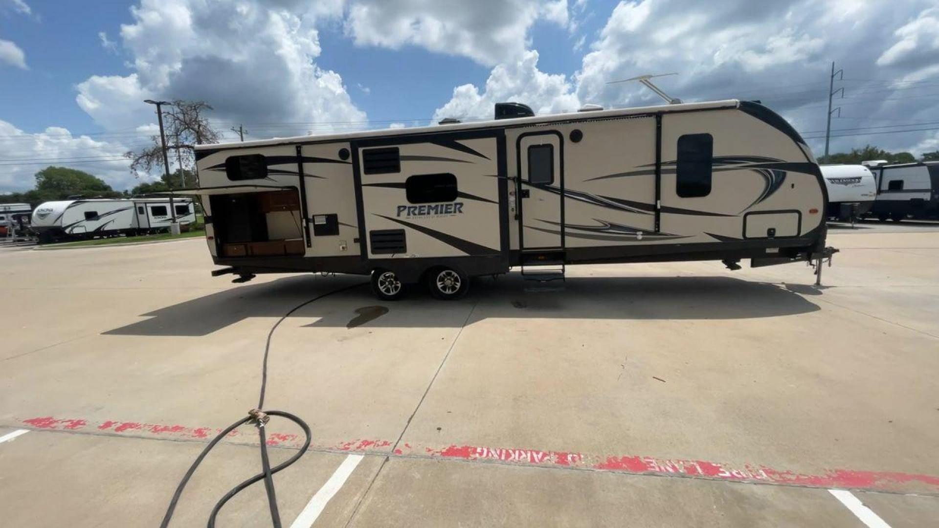 2015 TAN KEYSTONE PREMIER 34BHPR (4YDT34B25FD) , Length: 37 ft. | Dry Weight: 7,076 lbs. | Gross Weight: 8,800 lbs. | Slides: 3 transmission, located at 4319 N Main Street, Cleburne, TX, 76033, (817) 221-0660, 32.435829, -97.384178 - Take a trip with more family members and friends in this remarkably spacious 2015 Keystone Premier 34BHPR! This travel trailer measures exactly 37 ft. in length and 10.92 ft. in height. It has a dry weight of 7,076 lbs. and a GVWR of 8,800 lbs. It highlights a rear bunk and an outside kitchen, ma - Photo#2