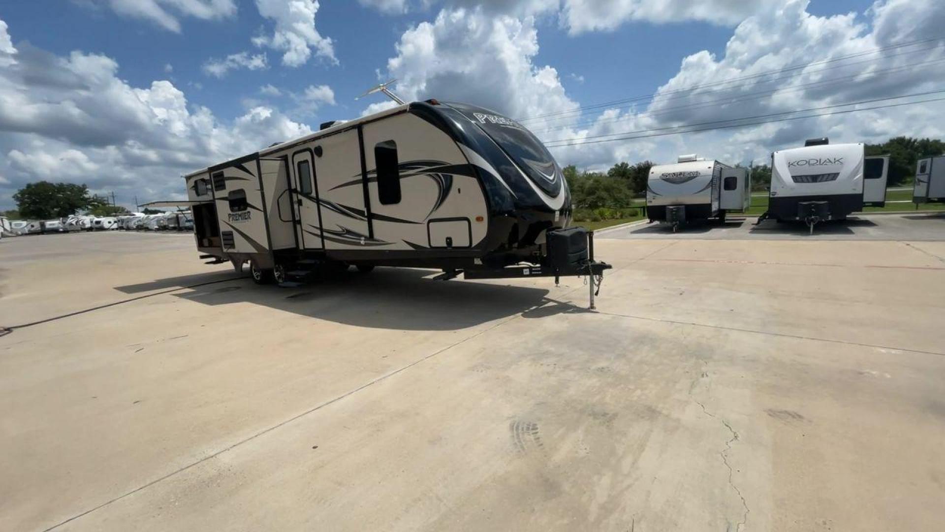 2015 TAN KEYSTONE PREMIER 34BHPR (4YDT34B25FD) , Length: 37 ft. | Dry Weight: 7,076 lbs. | Gross Weight: 8,800 lbs. | Slides: 3 transmission, located at 4319 N Main Street, Cleburne, TX, 76033, (817) 221-0660, 32.435829, -97.384178 - Take a trip with more family members and friends in this remarkably spacious 2015 Keystone Premier 34BHPR! This travel trailer measures exactly 37 ft. in length and 10.92 ft. in height. It has a dry weight of 7,076 lbs. and a GVWR of 8,800 lbs. It highlights a rear bunk and an outside kitchen, ma - Photo#3