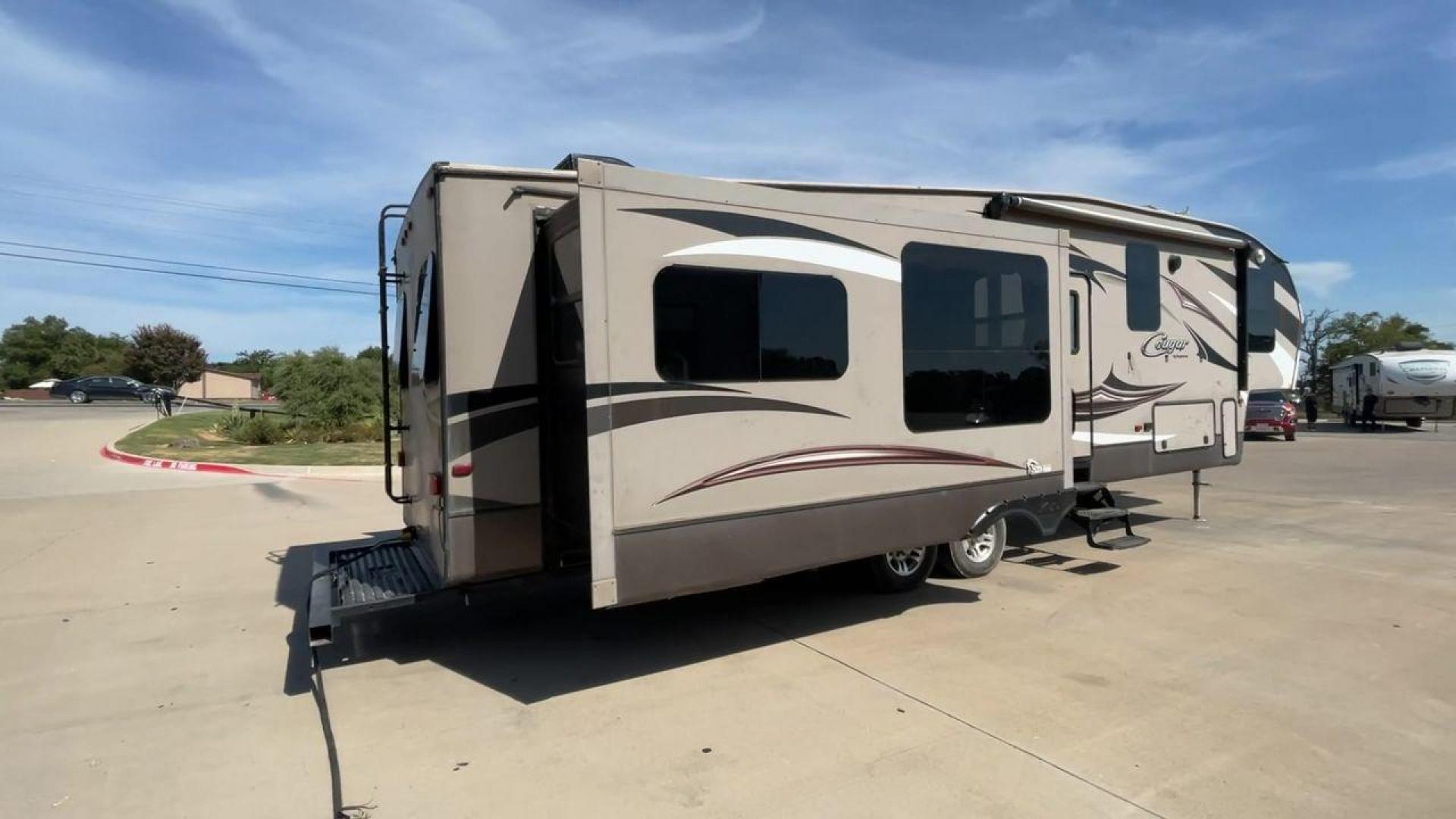 2015 KEYSTONE RV COUGAR 327RES (4YDF32729F2) , Length: 36.42 ft. | Dry Weight: 10,213 lbs. | Gross Weight: 12,135 lbs. | Slides: 3 transmission, located at 4319 N Main Street, Cleburne, TX, 76033, (817) 221-0660, 32.435829, -97.384178 - Enjoy the abundant storage and space that comes with the 2015 Keystone Cougar 327RES! This fifth wheel measures 36.42 ft. in length and 12.25 ft. in height. It has a dry weight of 10,213 lbs. and a GVWR of 12,135 lbs. It also comes equipped with automatic heating and cooling rated at 30,000 and 1 - Photo#1