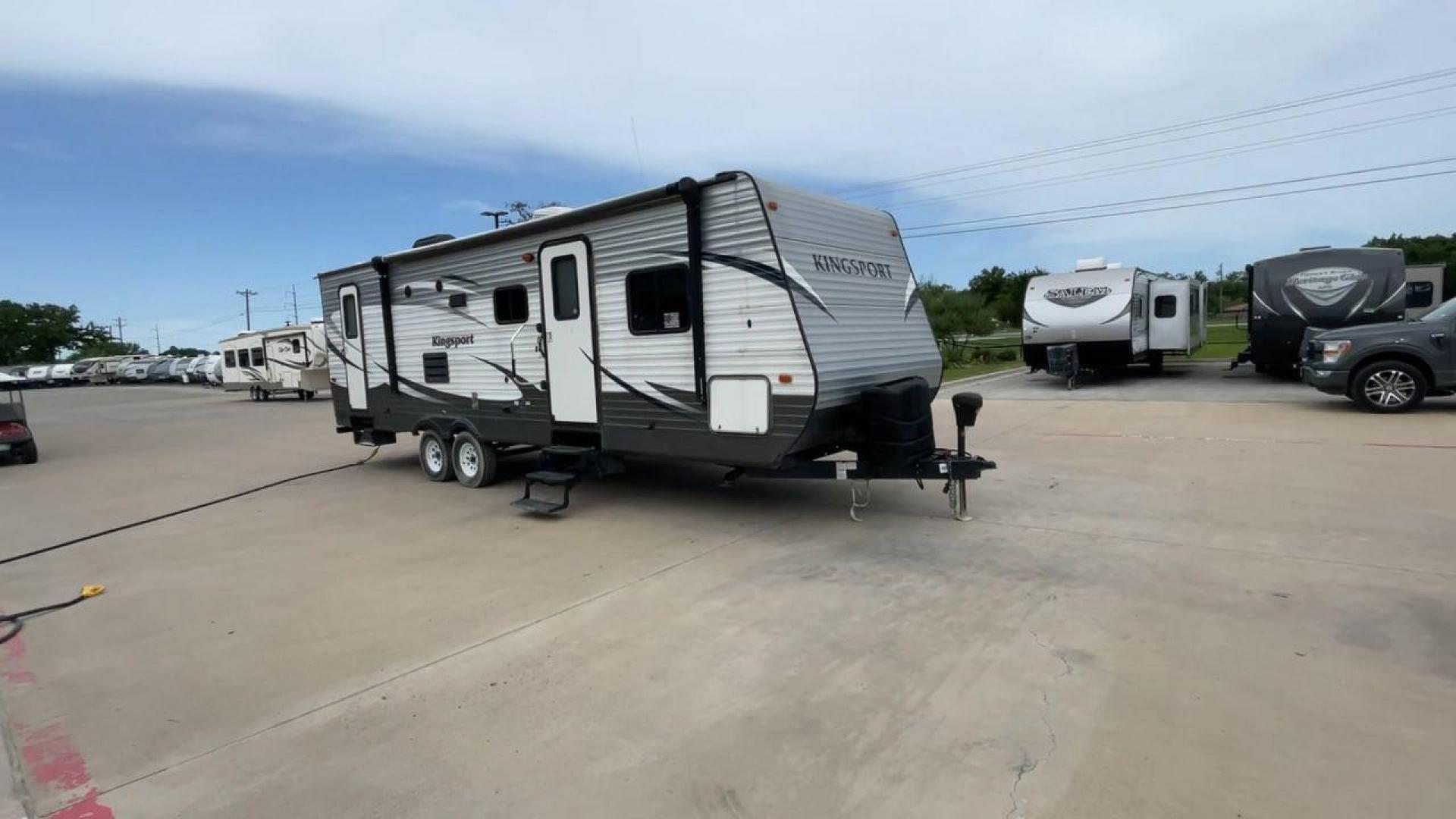 2015 WHITE KINGSPORT 277DDS - (1NL1GTM22F1) , Length: 31.17 ft. | Dry Weight: 6,620 lbs. | Slides: 1 transmission, located at 4319 N Main Street, Cleburne, TX, 76033, (817) 221-0660, 32.435829, -97.384178 - This 2015 Kingsport 277DDS measures 31.17 ft. in length and 10.75 ft. in height. It has a dry weight of 6,620 lbs. with a payload capacity of 1,520 lbs. and a hitch weight of 958 lbs. It includes two doors, one slide, and one awning. This travel trailer offers sleeping space for up to 10 people w - Photo#3