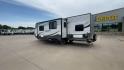 2015 WHITE KINGSPORT 277DDS - (1NL1GTM22F1) , Length: 31.17 ft. | Dry Weight: 6,620 lbs. | Slides: 1 transmission, located at 4319 N Main Street, Cleburne, TX, 76033, (817) 221-0660, 32.435829, -97.384178 - This 2015 Kingsport 277DDS measures 31.17 ft. in length and 10.75 ft. in height. It has a dry weight of 6,620 lbs. with a payload capacity of 1,520 lbs. and a hitch weight of 958 lbs. It includes two doors, one slide, and one awning. This travel trailer offers sleeping space for up to 10 people w - Photo#7