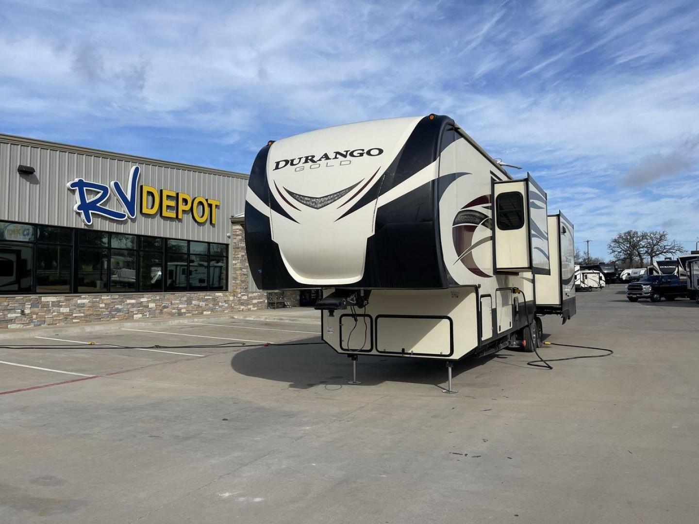 2015 TAN KZ DURANGO 370RLT (4EZFV3727F6) , Length: 39.5 ft. | Dry Weight: 11,686 lbs. | Gross Weight: 14,500 lbs. | Slides: 3 transmission, located at 4319 N Main Street, Cleburne, TX, 76033, (817) 221-0660, 32.435829, -97.384178 - The 2017 KZ Durango 370RLT measures 39.5 ft. in length. It has a dry weight of 11,686 lbs. and a GVWR of 14,500 lbs. It is made of aluminum and fiberglass. It has three spacious slides and comes with an automatic heating and cooling rate of 35,000 and 15,000 BTUs, respectively. This model features a - Photo#0