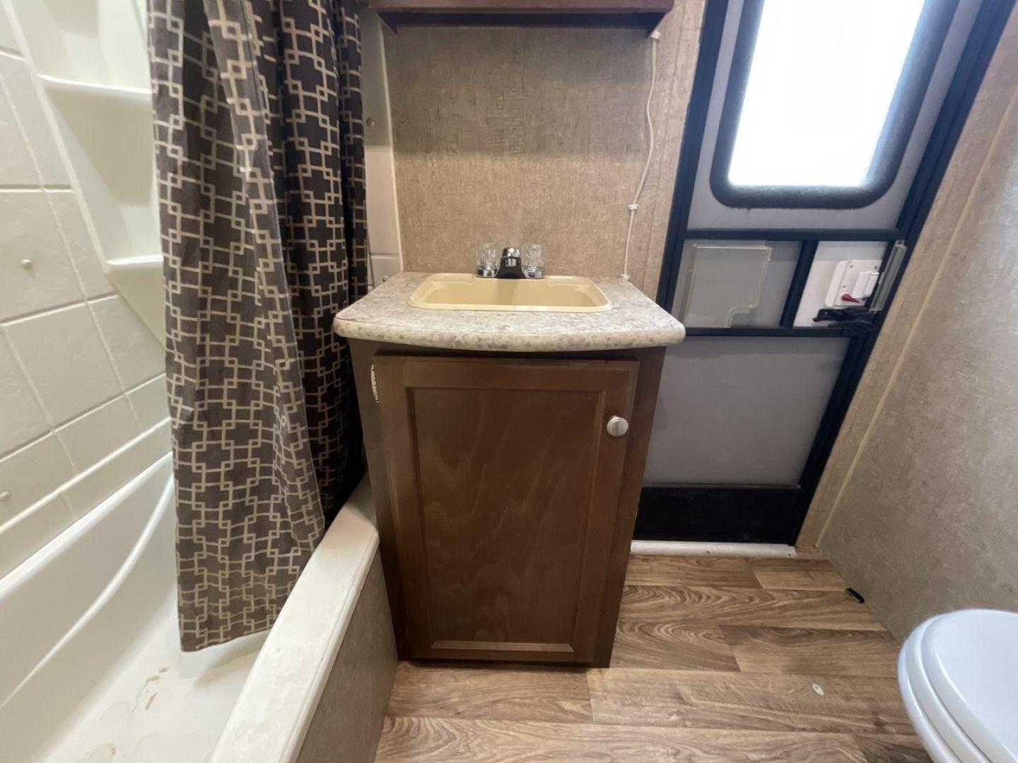 2015 WHITE KZ VENTURE RV SPORTTREK (4EZT13128F5) , Length: 35.6 ft | Dry Weight: 7,110 lbs | Gross Weight: 8,300 lbs | Slides: 2 transmission, located at 4319 N Main Street, Cleburne, TX, 76033, (817) 221-0660, 32.435829, -97.384178 - With the 2015 KZ Venture RV SportTrek Travel Trailer, set out on your next adventure. With the modern traveler in mind, this travel trailer offers the ideal balance of comfort, style, and functionality. This unit measures 35.5 ft in length, 8 ft in width, and 10.92 ft in height. It has a dry weig - Photo#16