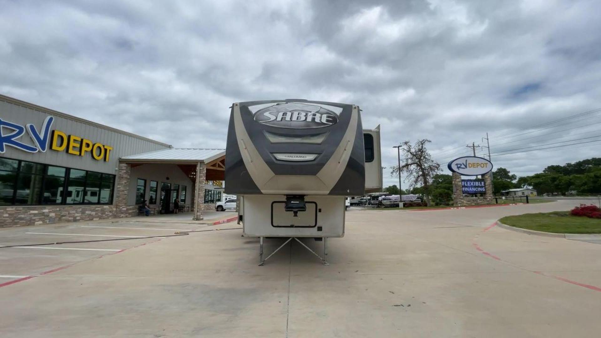 2015 TAN PALOMINO SABRE 34RDKS (4X4FSRK2XF3) , Length: 38.92 ft. | Dry Weight: 11,081 lbs. | Gross Weight: 13,950 lbs. | Slides: 4 transmission, located at 4319 N Main Street, Cleburne, TX, 76033, (817) 221-0660, 32.435829, -97.384178 - This 2015 Sabre Fifth Wheel measures at just under 39 feet with a dry weight of 11,081 lbs. It has a GVWR of 13,950 lbs and a hitch weight of 2,205 lbs. This unit has a heater rated at 35,000 BTUs and a cooler rated at 13,500 BTUs meaning the temperature is always in your control. This model has a b - Photo#4