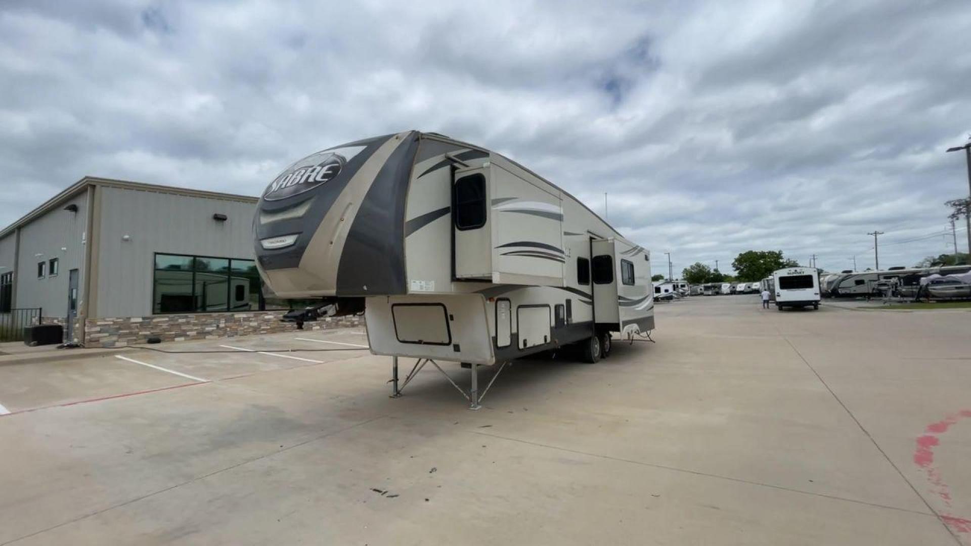 2015 TAN PALOMINO SABRE 34RDKS (4X4FSRK2XF3) , Length: 38.92 ft. | Dry Weight: 11,081 lbs. | Gross Weight: 13,950 lbs. | Slides: 4 transmission, located at 4319 N Main Street, Cleburne, TX, 76033, (817) 221-0660, 32.435829, -97.384178 - This 2015 Sabre Fifth Wheel measures at just under 39 feet with a dry weight of 11,081 lbs. It has a GVWR of 13,950 lbs and a hitch weight of 2,205 lbs. This unit has a heater rated at 35,000 BTUs and a cooler rated at 13,500 BTUs meaning the temperature is always in your control. This model has a b - Photo#5