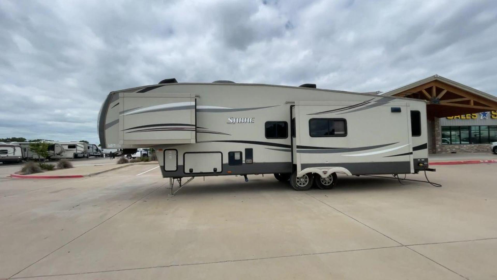 2015 TAN PALOMINO SABRE 34RDKS (4X4FSRK2XF3) , Length: 38.92 ft. | Dry Weight: 11,081 lbs. | Gross Weight: 13,950 lbs. | Slides: 4 transmission, located at 4319 N Main Street, Cleburne, TX, 76033, (817) 221-0660, 32.435829, -97.384178 - This 2015 Sabre Fifth Wheel measures at just under 39 feet with a dry weight of 11,081 lbs. It has a GVWR of 13,950 lbs and a hitch weight of 2,205 lbs. This unit has a heater rated at 35,000 BTUs and a cooler rated at 13,500 BTUs meaning the temperature is always in your control. This model has a b - Photo#6