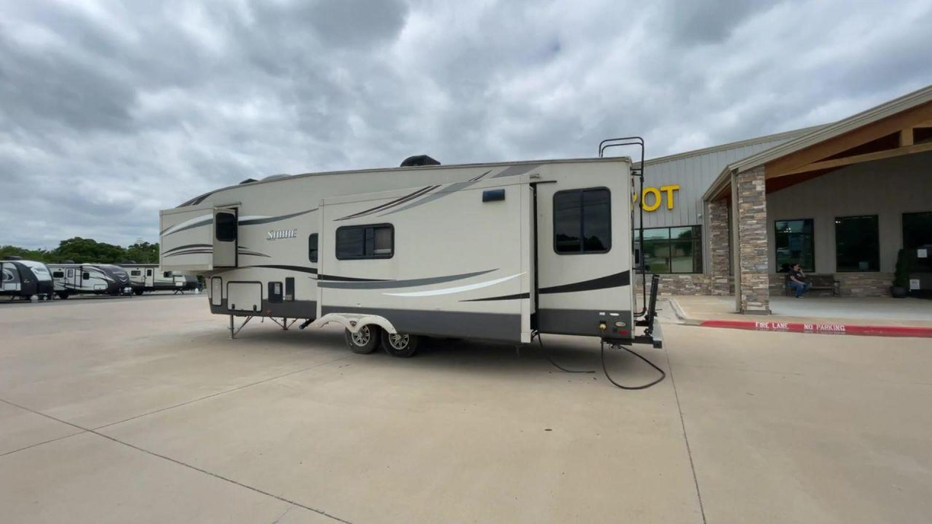 2015 TAN PALOMINO SABRE 34RDKS (4X4FSRK2XF3) , Length: 38.92 ft. | Dry Weight: 11,081 lbs. | Gross Weight: 13,950 lbs. | Slides: 4 transmission, located at 4319 N Main Street, Cleburne, TX, 76033, (817) 221-0660, 32.435829, -97.384178 - This 2015 Sabre Fifth Wheel measures at just under 39 feet with a dry weight of 11,081 lbs. It has a GVWR of 13,950 lbs and a hitch weight of 2,205 lbs. This unit has a heater rated at 35,000 BTUs and a cooler rated at 13,500 BTUs meaning the temperature is always in your control. This model has a b - Photo#7