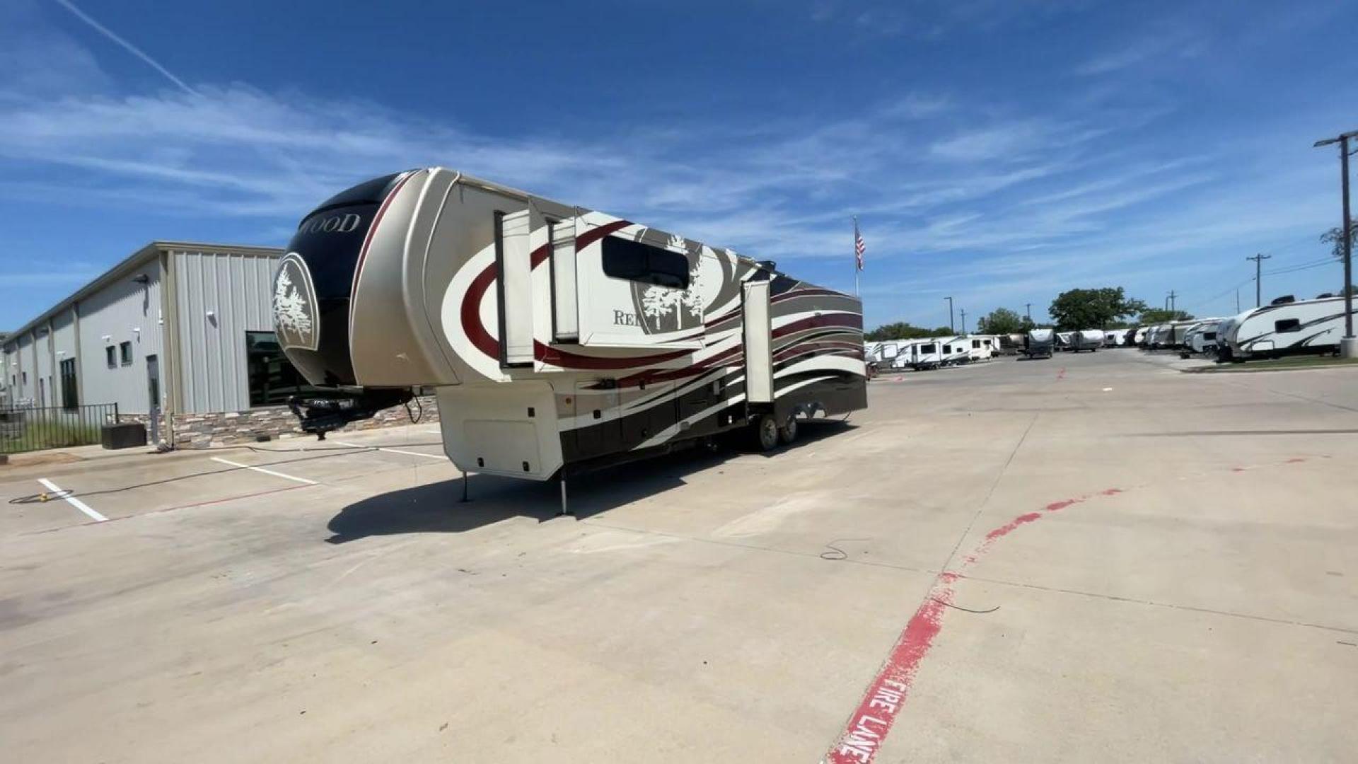 2015 REDWOOD 38RL (4V0FC3823FR) , Length: 41.42 ft. | Dry Weight: 13,672 lbs. | Gross Weight: 16,500 lbs. | Slides: 3 transmission, located at 4319 N Main Street, Cleburne, TX, 76033, (817) 221-0660, 32.435829, -97.384178 - The 2015 Redwood 38RL is a stunning fifth wheel that offers luxury, comfort, and spacious living. With an overall length of 41.42 feet and a dry weight of 13,672 lbs, this unit is built for those seeking an upscale RVing experience. The exterior features a sleek and modern design with bold maroon an - Photo#5