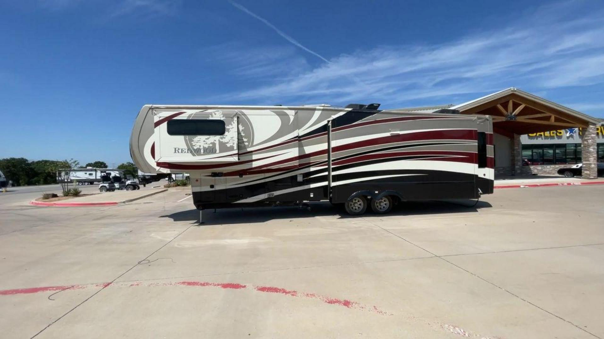 2015 REDWOOD 38RL (4V0FC3823FR) , Length: 41.42 ft. | Dry Weight: 13,672 lbs. | Gross Weight: 16,500 lbs. | Slides: 3 transmission, located at 4319 N Main Street, Cleburne, TX, 76033, (817) 221-0660, 32.435829, -97.384178 - The 2015 Redwood 38RL is a stunning fifth wheel that offers luxury, comfort, and spacious living. With an overall length of 41.42 feet and a dry weight of 13,672 lbs, this unit is built for those seeking an upscale RVing experience. The exterior features a sleek and modern design with bold maroon an - Photo#6