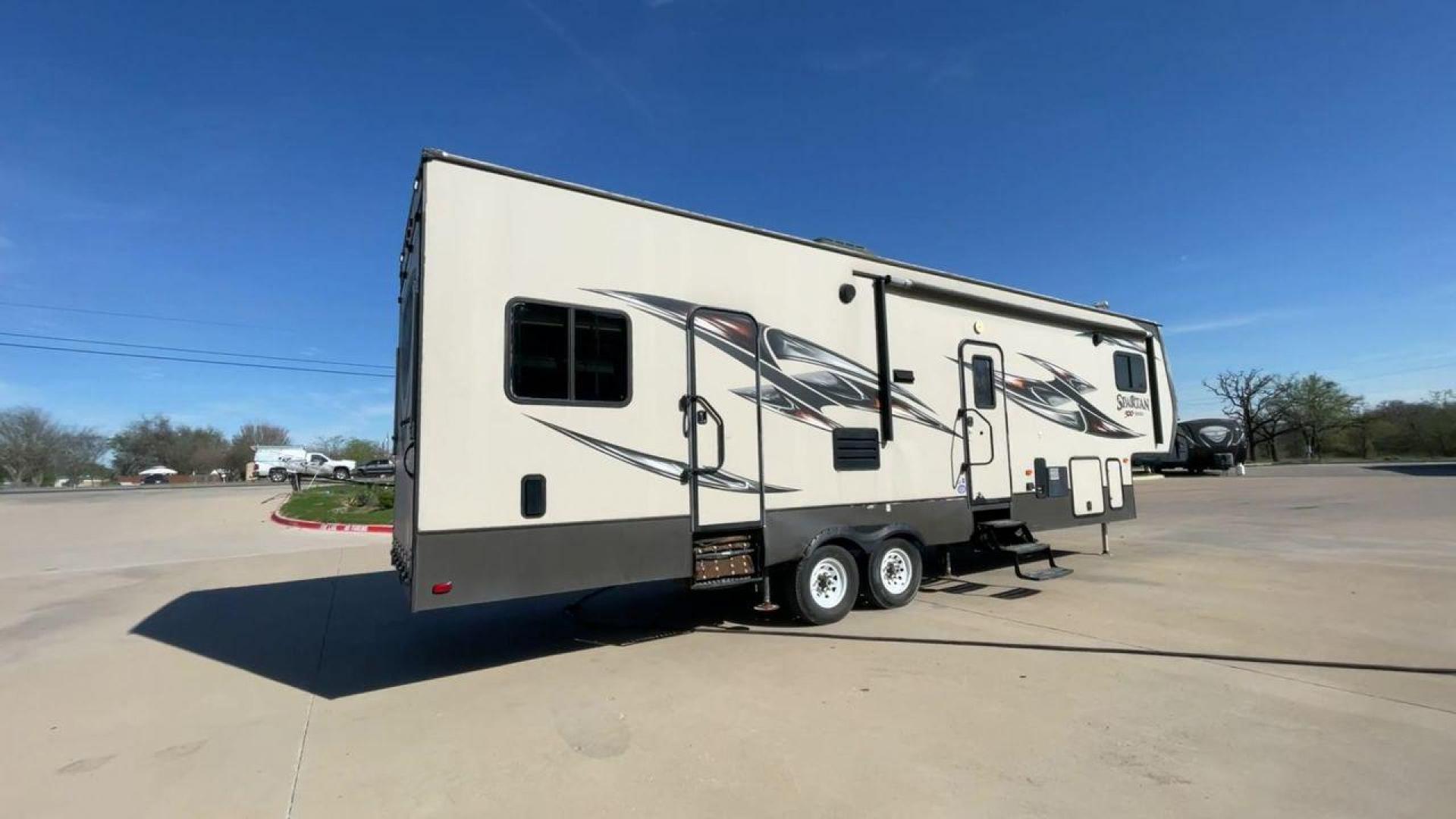 2015 WHITE SPARTAN 3210 (5ZT3STXBXFG) , located at 4319 N Main Street, Cleburne, TX, 76033, (817) 221-0660, 32.435829, -97.384178 - Here are additional factors highlighting why owning this RV is a superb choice. (1) The 2015 Spartan 3210 Toy Hauler has Aluminum-framed construction with vacuum-bonded laminated sidewalls (2) It features Electric patio awning, Pass-through storage compartments and Spare tire with lockable compa - Photo#1