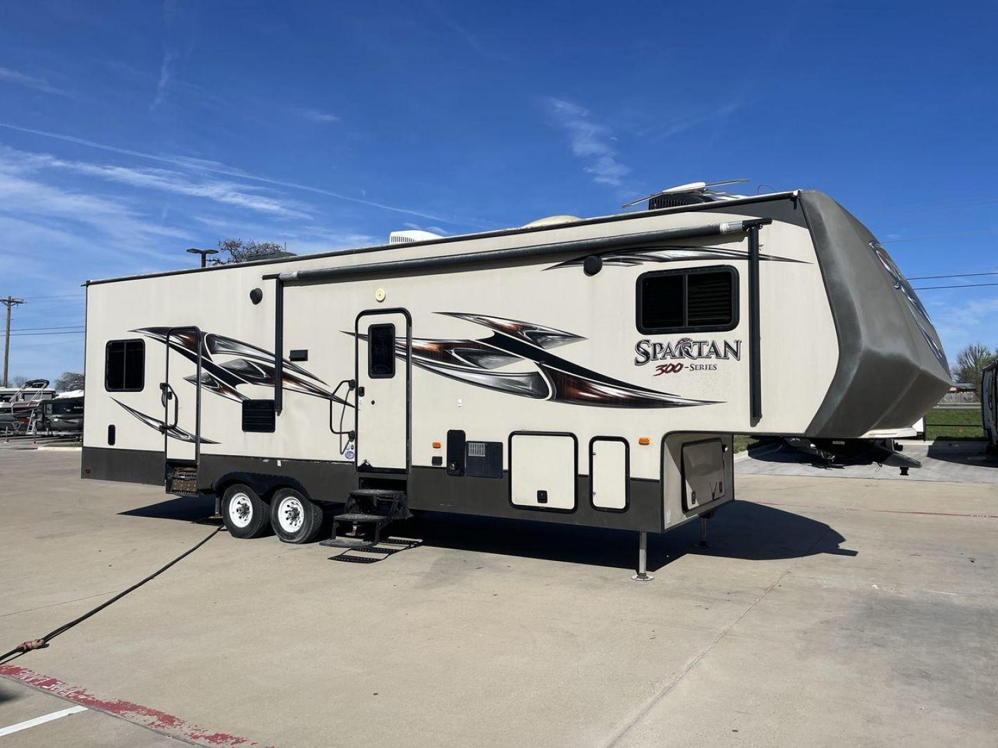 2015 WHITE SPARTAN 3210 (5ZT3STXBXFG) , located at 4319 N Main Street, Cleburne, TX, 76033, (817) 221-0660, 32.435829, -97.384178 - Here are additional factors highlighting why owning this RV is a superb choice. (1) The 2015 Spartan 3210 Toy Hauler has Aluminum-framed construction with vacuum-bonded laminated sidewalls (2) It features Electric patio awning, Pass-through storage compartments and Spare tire with lockable compa - Photo#23