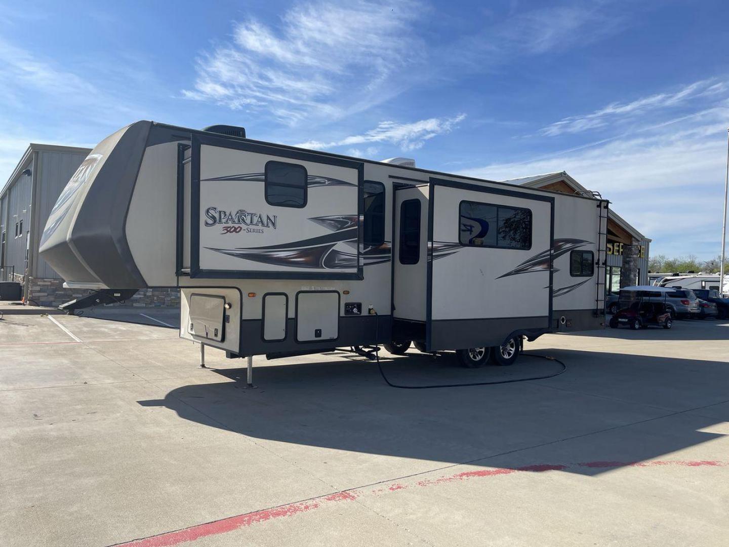 2015 WHITE SPARTAN 3210 (5ZT3STXBXFG) , located at 4319 N Main Street, Cleburne, TX, 76033, (817) 221-0660, 32.435829, -97.384178 - Here are additional factors highlighting why owning this RV is a superb choice. (1) The 2015 Spartan 3210 Toy Hauler has Aluminum-framed construction with vacuum-bonded laminated sidewalls (2) It features Electric patio awning, Pass-through storage compartments and Spare tire with lockable compa - Photo#24