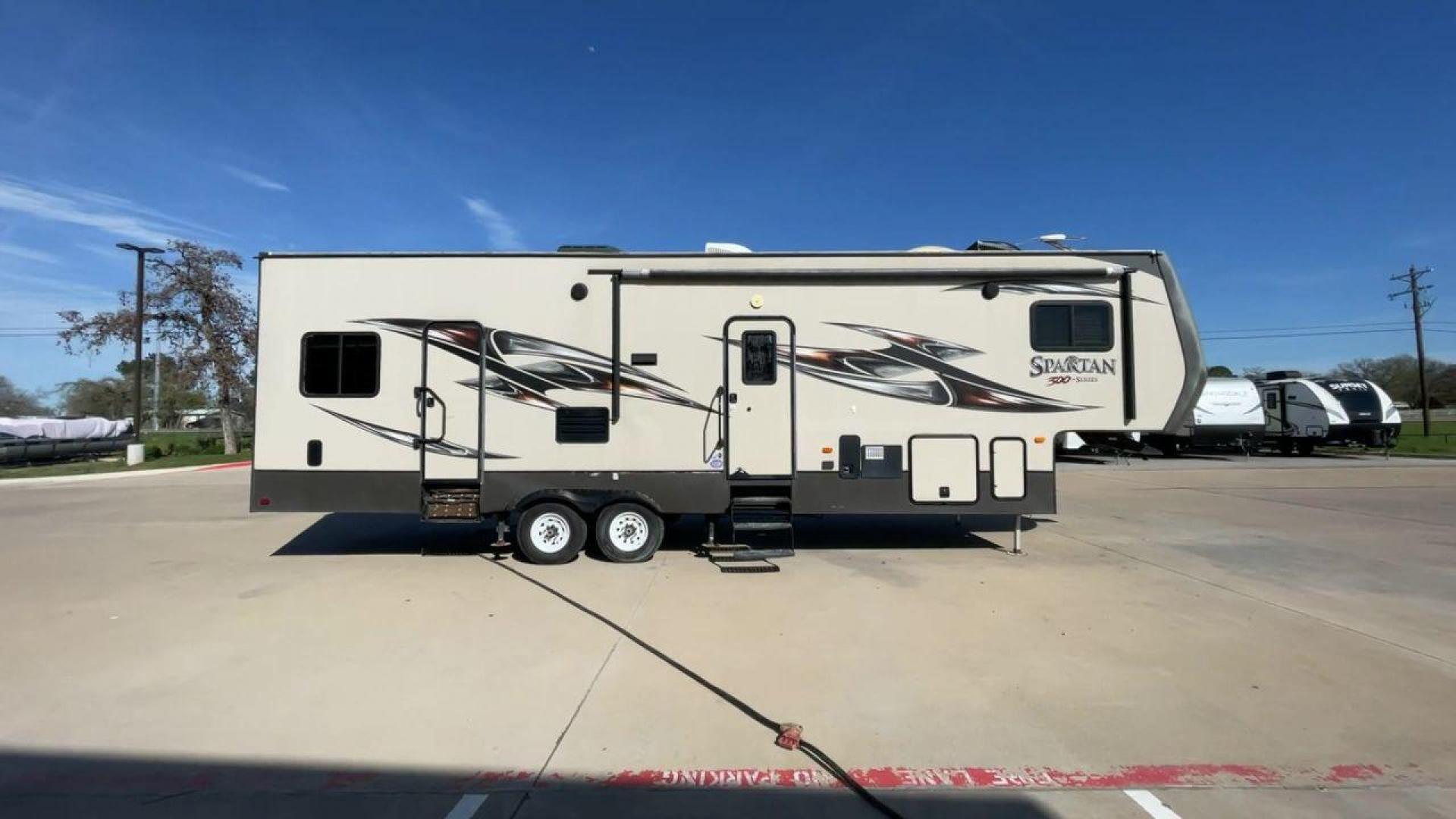 2015 WHITE SPARTAN 3210 (5ZT3STXBXFG) , located at 4319 N Main Street, Cleburne, TX, 76033, (817) 221-0660, 32.435829, -97.384178 - Here are additional factors highlighting why owning this RV is a superb choice. (1) The 2015 Spartan 3210 Toy Hauler has Aluminum-framed construction with vacuum-bonded laminated sidewalls (2) It features Electric patio awning, Pass-through storage compartments and Spare tire with lockable compa - Photo#2