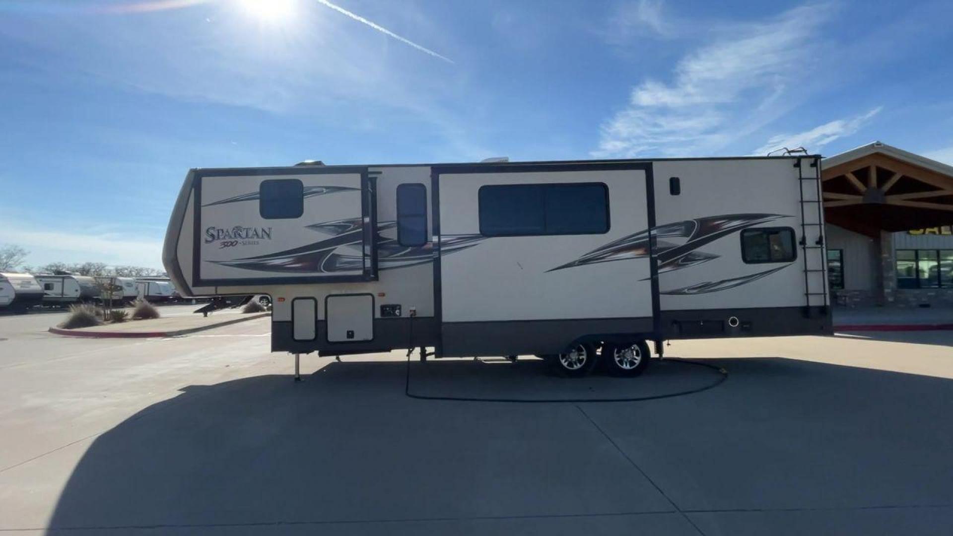 2015 WHITE SPARTAN 3210 (5ZT3STXBXFG) , located at 4319 N Main Street, Cleburne, TX, 76033, (817) 221-0660, 32.435829, -97.384178 - Here are additional factors highlighting why owning this RV is a superb choice. (1) The 2015 Spartan 3210 Toy Hauler has Aluminum-framed construction with vacuum-bonded laminated sidewalls (2) It features Electric patio awning, Pass-through storage compartments and Spare tire with lockable compa - Photo#6