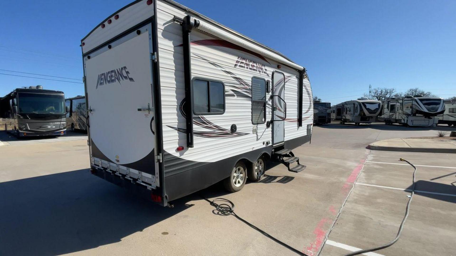 2015 WHITE VENGEANCE 19V (4X4TVGU27FY) , Length: 25 ft. | Dry Weight: 5,166 lbs. | Gross Weight: 7,945 lbs. transmission, located at 4319 N Main Street, Cleburne, TX, 76033, (817) 221-0660, 32.435829, -97.384178 - The 2015 Forest River Vengeance 19V is a compact and inviting travel trailer that brings simplicity and comfort to your adventures. With a length of ~25 feet and a width of 8 feet, this trailer has a manageable size, making it easy to tow with a compatible vehicle. The sleeping capacity generously a - Photo#1