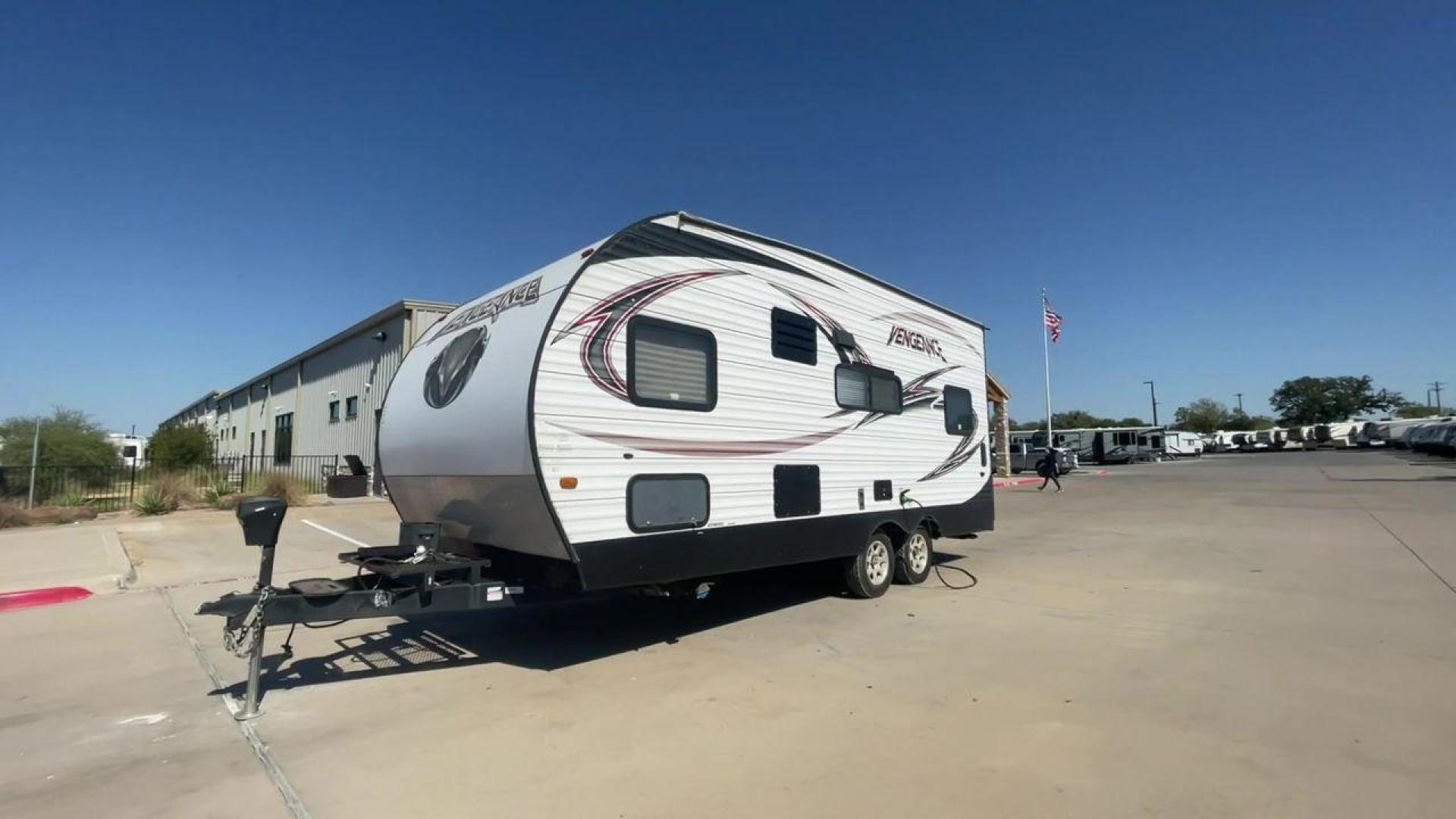 2015 WHITE VENGEANCE 19V (4X4TVGU27FY) , Length: 25 ft. | Dry Weight: 5,166 lbs. | Gross Weight: 7,945 lbs. transmission, located at 4319 N Main Street, Cleburne, TX, 76033, (817) 221-0660, 32.435829, -97.384178 - The 2015 Forest River Vengeance 19V is a compact and inviting travel trailer that brings simplicity and comfort to your adventures. With a length of ~25 feet and a width of 8 feet, this trailer has a manageable size, making it easy to tow with a compatible vehicle. The sleeping capacity generously a - Photo#5