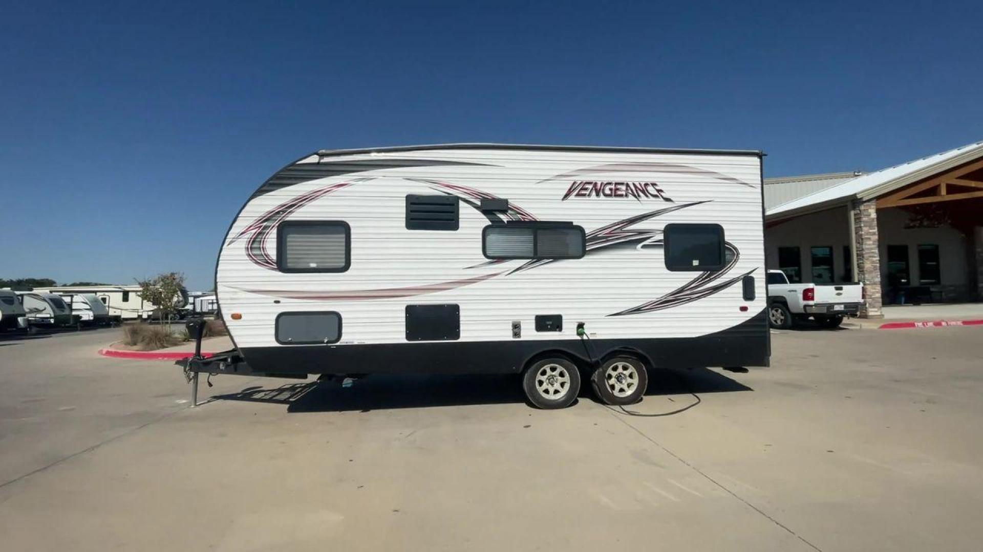 2015 WHITE VENGEANCE 19V (4X4TVGU27FY) , Length: 25 ft. | Dry Weight: 5,166 lbs. | Gross Weight: 7,945 lbs. transmission, located at 4319 N Main Street, Cleburne, TX, 76033, (817) 221-0660, 32.435829, -97.384178 - The 2015 Forest River Vengeance 19V is a compact and inviting travel trailer that brings simplicity and comfort to your adventures. With a length of ~25 feet and a width of 8 feet, this trailer has a manageable size, making it easy to tow with a compatible vehicle. The sleeping capacity generously a - Photo#6