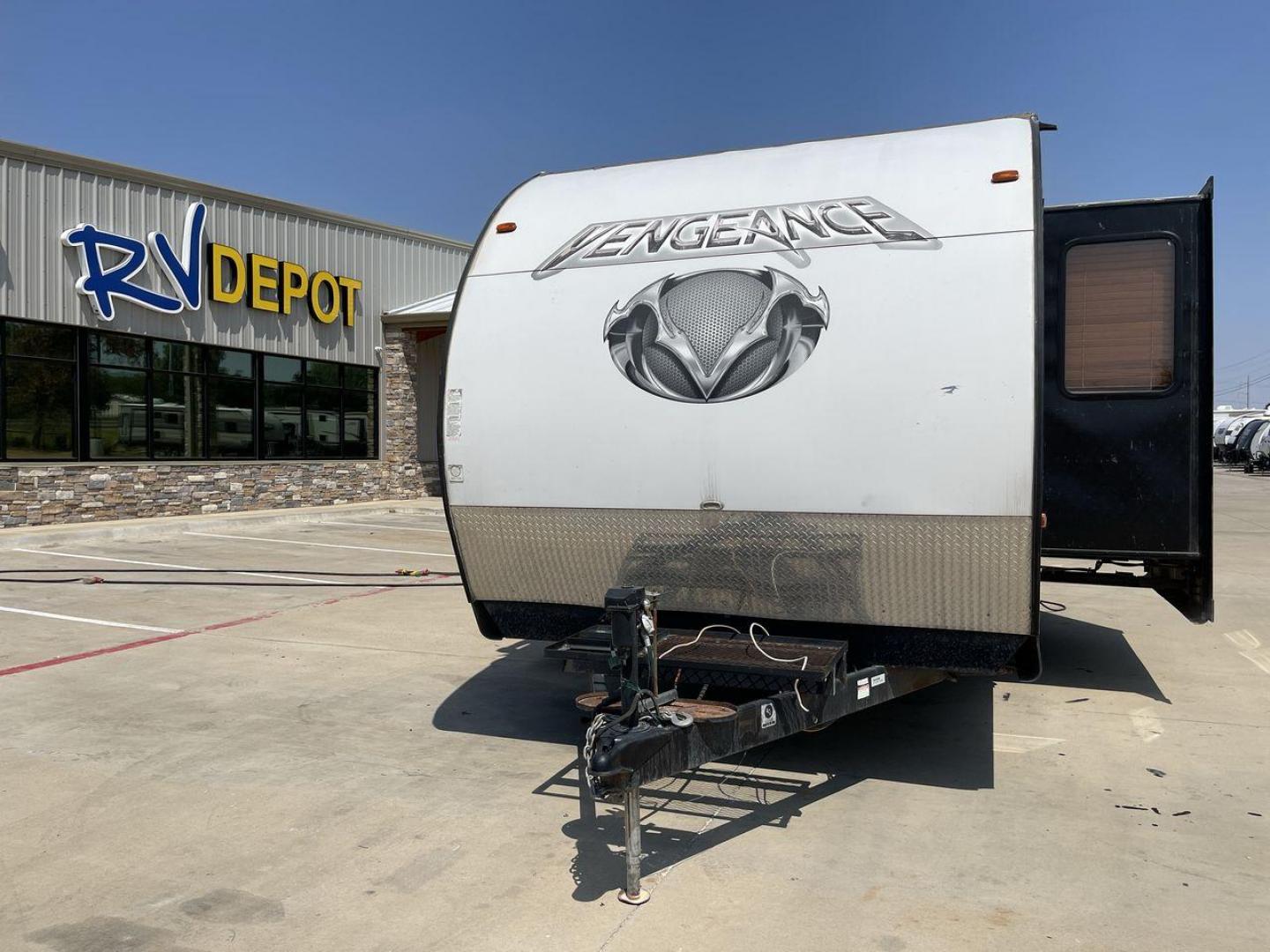 2015 WHITE VENGEANCE SU 29V (4X4TVGE24FY) , Length: 34.5 ft. | Dry Weight: 7,618 lbs. | Gross Weight: 9,985 lbs. | Slides: 1 transmission, located at 4319 N Main Street, Cleburne, TX, 76033, (817) 221-0660, 32.435829, -97.384178 - The 2015 Vengeance SU 29V is a versatile and spacious toy hauler, ideal for outdoor enthusiasts who crave adventure. With a length of 34.5 feet and a dry weight of 7,618 pounds, this travel trailer provides generous storage space while ensuring your comfort is not compromised. With a single slide, t - Photo#0