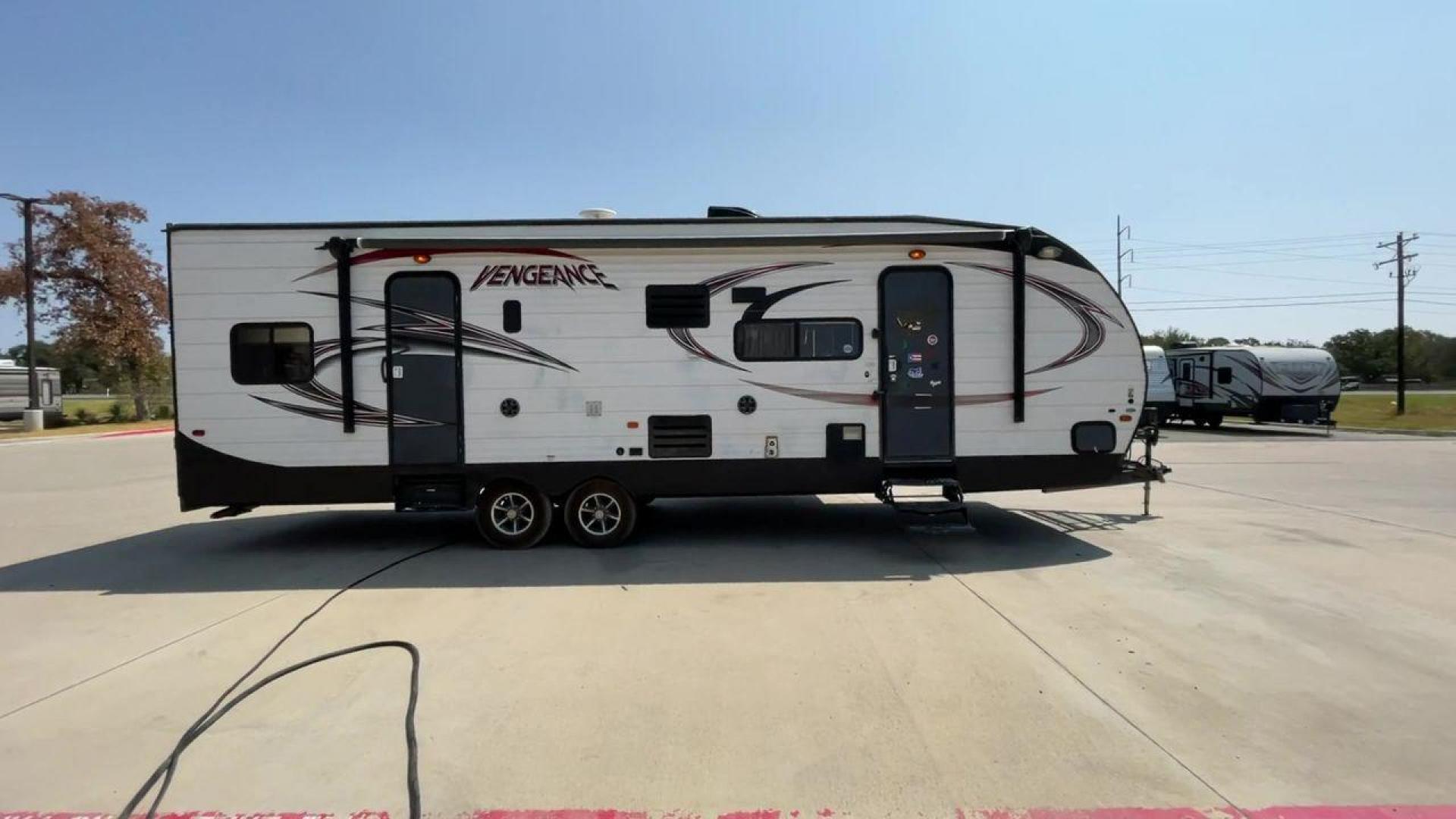 2015 WHITE VENGEANCE SU 29V (4X4TVGE24FY) , Length: 34.5 ft. | Dry Weight: 7,618 lbs. | Gross Weight: 9,985 lbs. | Slides: 1 transmission, located at 4319 N Main Street, Cleburne, TX, 76033, (817) 221-0660, 32.435829, -97.384178 - The 2015 Vengeance SU 29V is a versatile and spacious toy hauler, ideal for outdoor enthusiasts who crave adventure. With a length of 34.5 feet and a dry weight of 7,618 pounds, this travel trailer provides generous storage space while ensuring your comfort is not compromised. With a single slide, t - Photo#2