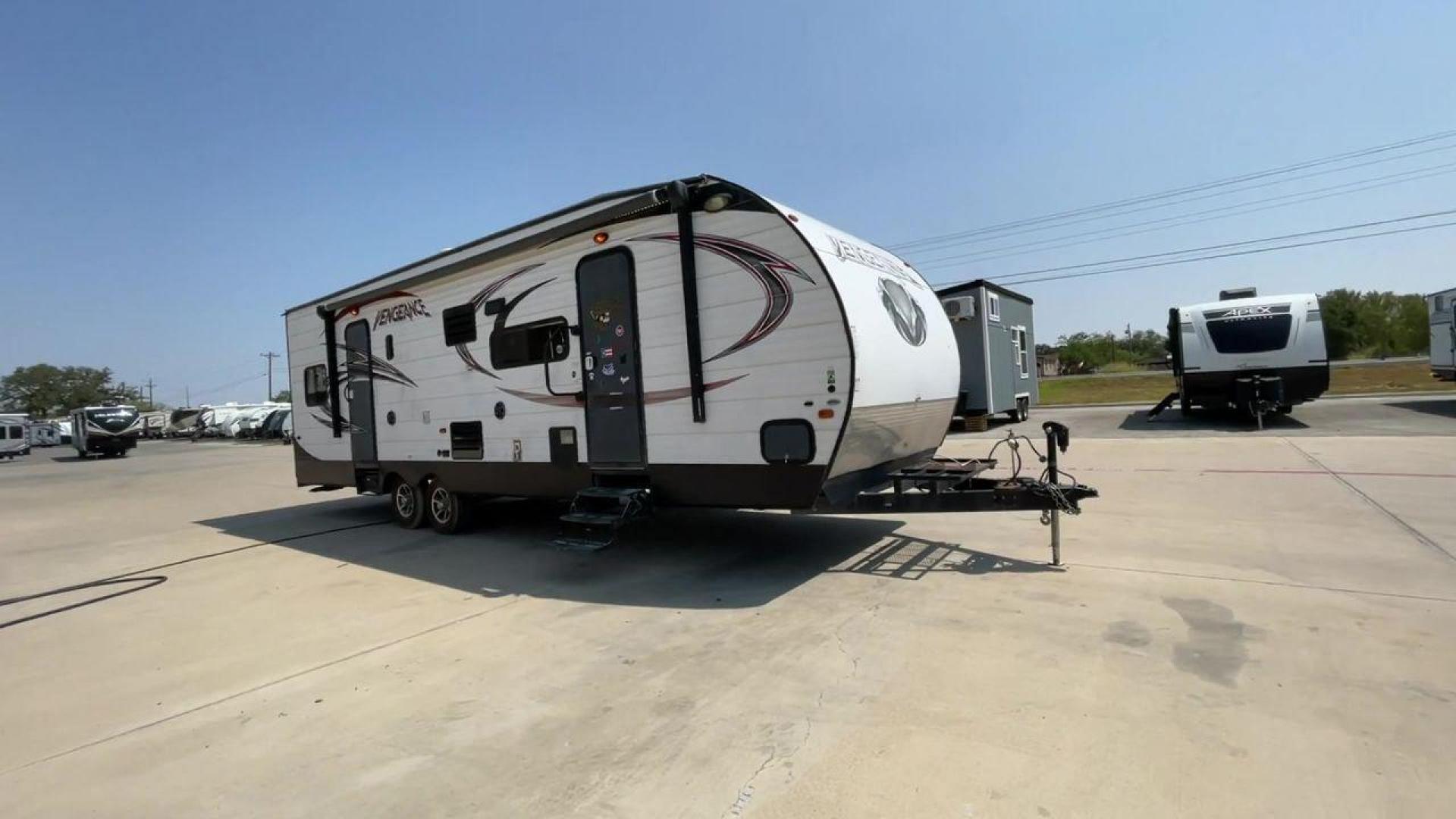 2015 WHITE VENGEANCE SU 29V (4X4TVGE24FY) , Length: 34.5 ft. | Dry Weight: 7,618 lbs. | Gross Weight: 9,985 lbs. | Slides: 1 transmission, located at 4319 N Main Street, Cleburne, TX, 76033, (817) 221-0660, 32.435829, -97.384178 - The 2015 Vengeance SU 29V is a versatile and spacious toy hauler, ideal for outdoor enthusiasts who crave adventure. With a length of 34.5 feet and a dry weight of 7,618 pounds, this travel trailer provides generous storage space while ensuring your comfort is not compromised. With a single slide, t - Photo#3