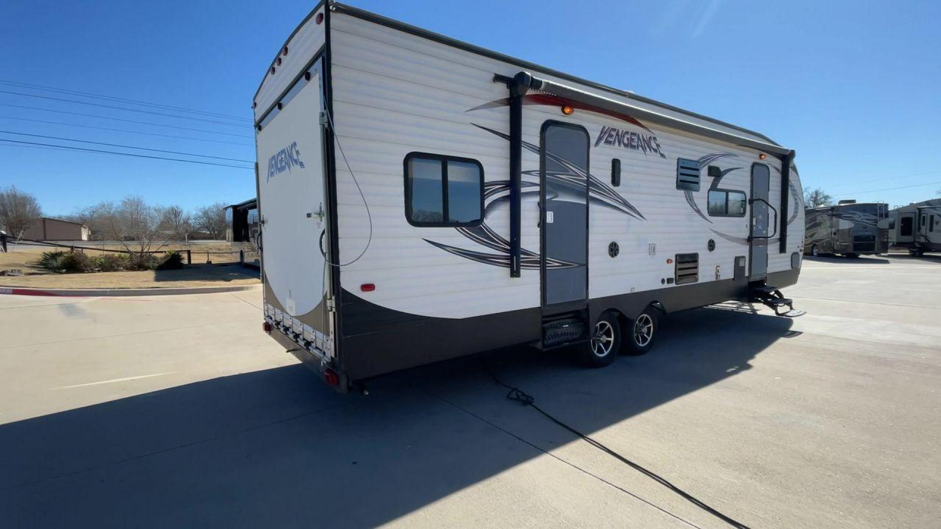 2015 WHITE VENGEANCE SU 29V (4X4TVGE24FY) , Length: 34.5 ft. | Dry Weight: 7,618 lbs. | Gross Weight: 9,985 lbs. | Slides: 1 transmission, located at 4319 N Main Street, Cleburne, TX, 76033, (817) 221-0660, 32.435829, -97.384178 - The 2015 Vengeance SU 29V is a versatile and spacious toy hauler, ideal for outdoor enthusiasts who crave adventure. With a length of 34.5 feet and a dry weight of 7,618 pounds, this travel trailer provides generous storage space while ensuring your comfort is not compromised. With a single slide, t - Photo#1