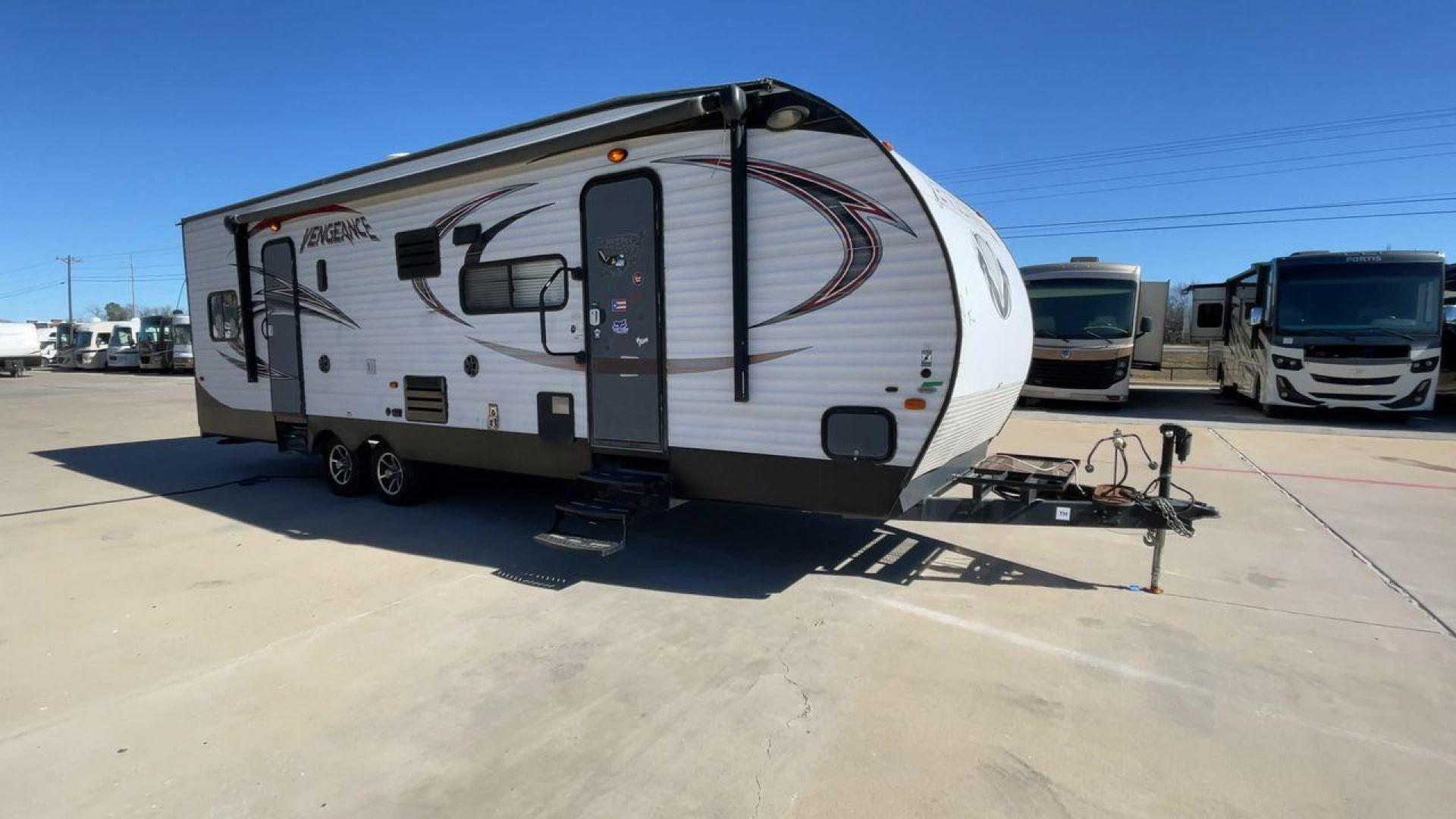 2015 WHITE VENGEANCE SU 29V (4X4TVGE24FY) , Length: 34.5 ft. | Dry Weight: 7,618 lbs. | Gross Weight: 9,985 lbs. | Slides: 1 transmission, located at 4319 N Main Street, Cleburne, TX, 76033, (817) 221-0660, 32.435829, -97.384178 - The 2015 Vengeance SU 29V is a versatile and spacious toy hauler, ideal for outdoor enthusiasts who crave adventure. With a length of 34.5 feet and a dry weight of 7,618 pounds, this travel trailer provides generous storage space while ensuring your comfort is not compromised. With a single slide, t - Photo#3