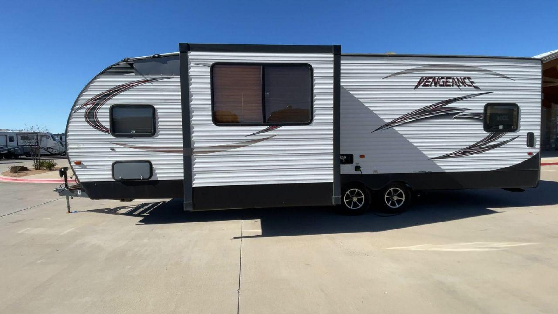 2015 WHITE VENGEANCE SU 29V (4X4TVGE24FY) , Length: 34.5 ft. | Dry Weight: 7,618 lbs. | Gross Weight: 9,985 lbs. | Slides: 1 transmission, located at 4319 N Main Street, Cleburne, TX, 76033, (817) 221-0660, 32.435829, -97.384178 - The 2015 Vengeance SU 29V is a versatile and spacious toy hauler, ideal for outdoor enthusiasts who crave adventure. With a length of 34.5 feet and a dry weight of 7,618 pounds, this travel trailer provides generous storage space while ensuring your comfort is not compromised. With a single slide, t - Photo#6