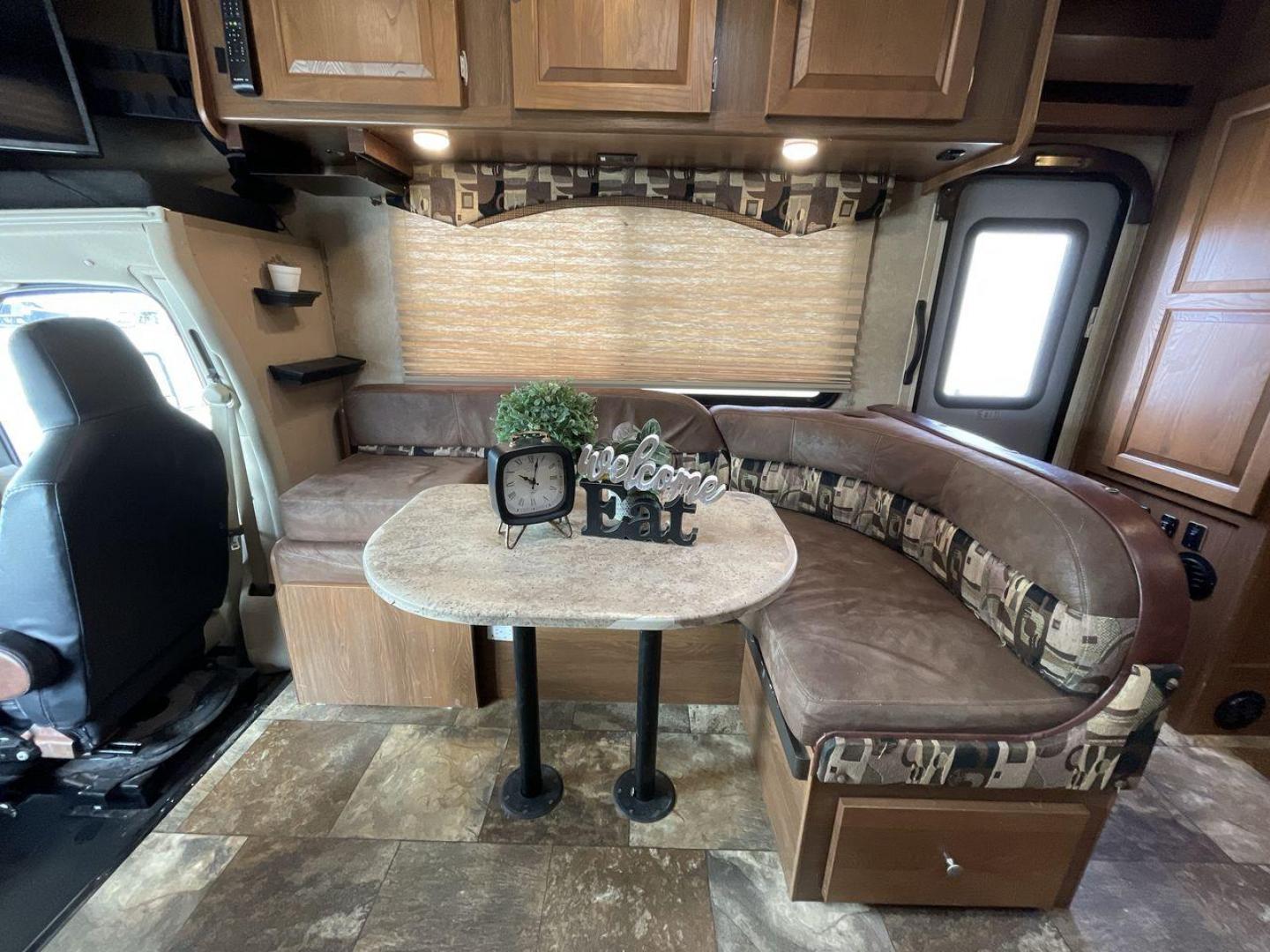 2016 COACHMEN LEPRECHAUN 260DS (1FDXE4FS5GD) , Length: 27.42 ft. | Dry Weight: 11,450 lbs. | Gross Weight: 14,500 lbs. | Slides: 2 transmission, located at 4319 N Main Street, Cleburne, TX, 76033, (817) 221-0660, 32.435829, -97.384178 - The 2016 Coachmen Leprechaun 260DS RV has an attractive exterior design, with a length of 27.42 feet. The vehicle's body is finished in beige with stylish brown and cream graphics running along the sides, with the "Leprechaun" branding prominently displayed up front. The front cab section has a clas - Photo#6