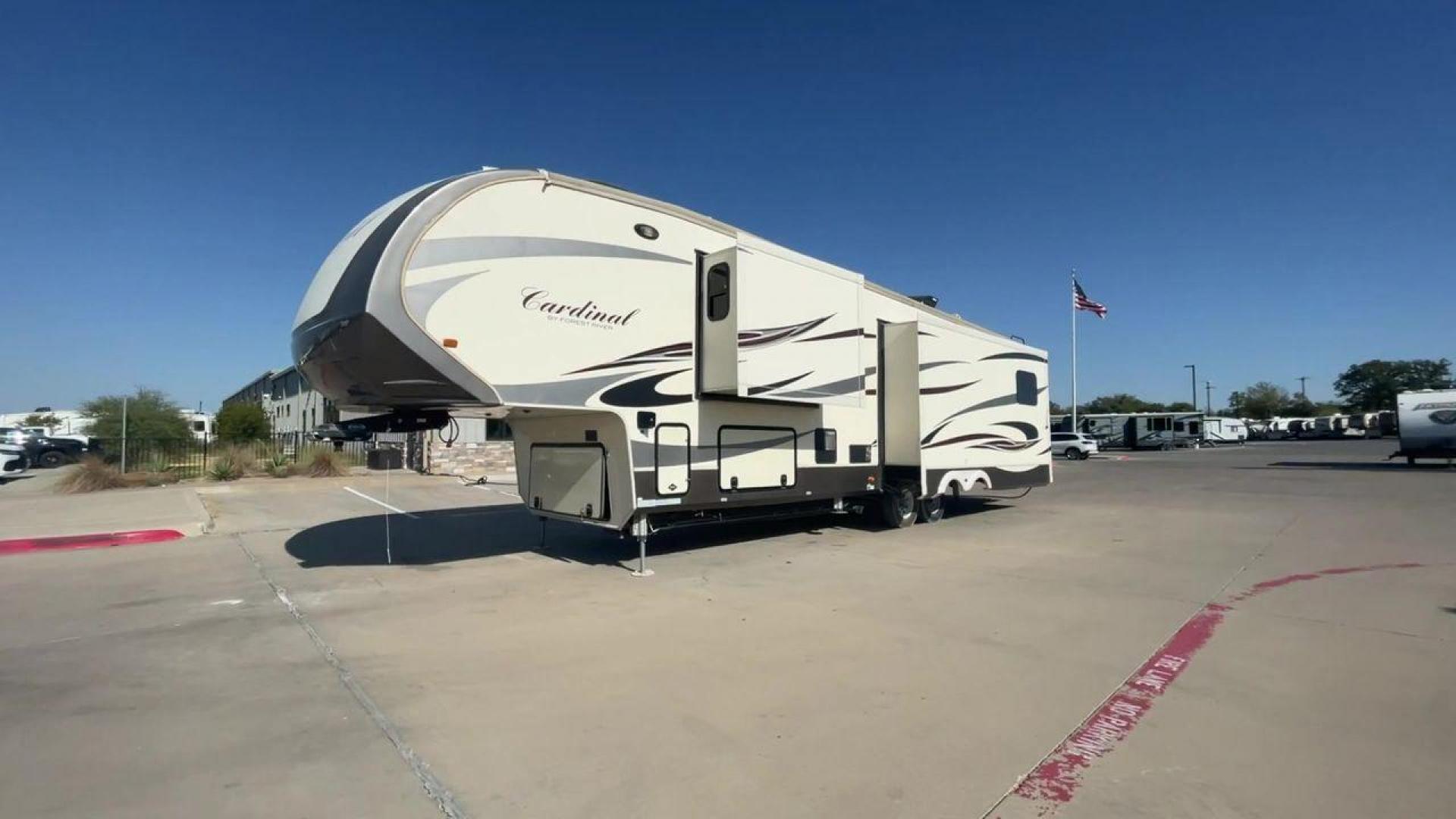 2016 BEIGE FOREST RIVER CARDINAL 3875FB - (4X4FCAR23GG) , Length: 40.5 ft. | Dry Weight: 14,034 lbs. | Gross Weight: 16,170 lbs. | Slides: 3 transmission, located at 4319 N Main Street, Cleburne, TX, 76033, (817) 221-0660, 32.435829, -97.384178 - The elegant and well-equipped 2016 Forest River Cardinal 3875FB travel trailer will elevate your camping experience. Designed with care, this fifth wheel provides you with comfort, utility, and style for your road trips. This fifth wheel have dimensions of 40.5 ft in length, 8.33 ft in width, and 13 - Photo#5