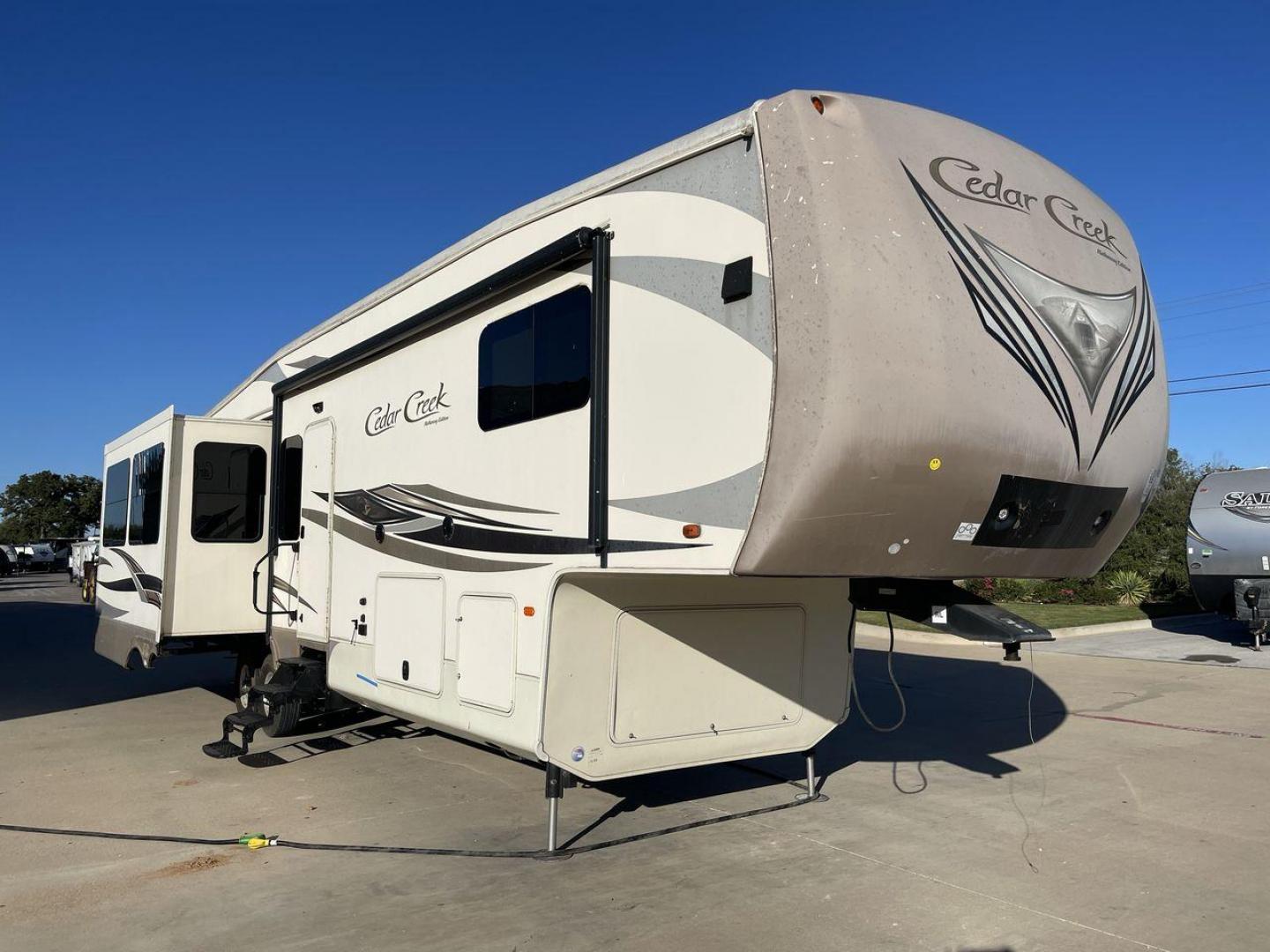 2016 FOREST RIVER CEDAR CREEK 36CKTS - (4X4FCRM24GS) , Length: 39.83 ft. | Dry Weight: 12,670 lbs. | Gross Weight: 16,407 lbs. | Slides: 3 transmission, located at 4319 N Main Street, Cleburne, TX, 76033, (817) 221-0660, 32.435829, -97.384178 - RV Depot in Cleburne, TX is offering a fantastic deal on a 2016 Forest River Cedar Creek 36KTS fifth wheel rear living vehicle. Priced at just $53,995, this luxurious RV is perfect for those looking to hit the open road and explore the local driving highlights around Cleburne, TX. Located in Clebur - Photo#22