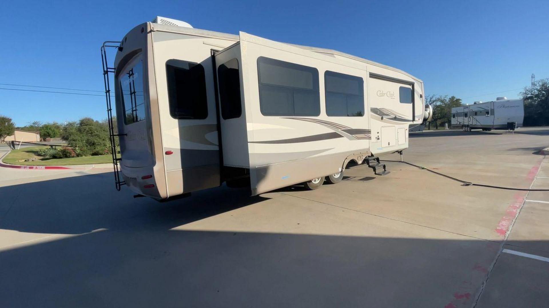 2016 FOREST RIVER CEDAR CREEK 36CKTS - (4X4FCRM24GS) , Length: 39.83 ft. | Dry Weight: 12,670 lbs. | Gross Weight: 16,407 lbs. | Slides: 3 transmission, located at 4319 N Main Street, Cleburne, TX, 76033, (817) 221-0660, 32.435829, -97.384178 - RV Depot in Cleburne, TX is offering a fantastic deal on a 2016 Forest River Cedar Creek 36KTS fifth wheel rear living vehicle. Priced at just $53,995, this luxurious RV is perfect for those looking to hit the open road and explore the local driving highlights around Cleburne, TX. Located in Clebur - Photo#1