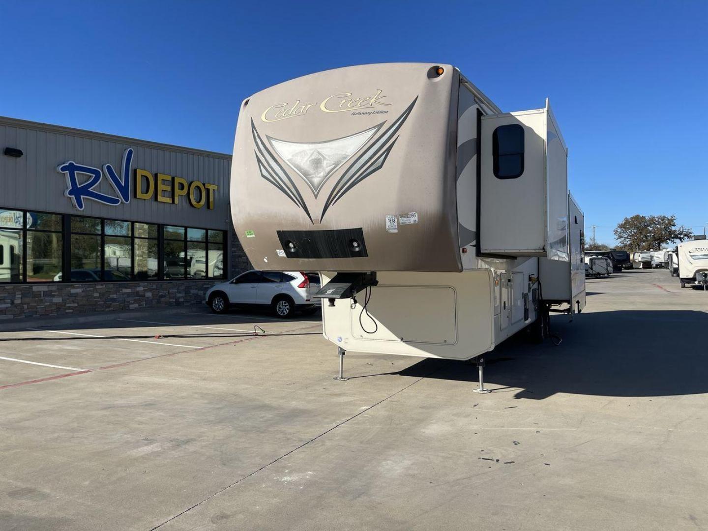 2016 FOREST RIVER CEDAR CREEK 36CKTS - (4X4FCRM24GS) , Length: 39.83 ft. | Dry Weight: 12,670 lbs. | Gross Weight: 16,407 lbs. | Slides: 3 transmission, located at 4319 N Main Street, Cleburne, TX, 76033, (817) 221-0660, 32.435829, -97.384178 - RV Depot in Cleburne, TX is offering a fantastic deal on a 2016 Forest River Cedar Creek 36KTS fifth wheel rear living vehicle. Priced at just $53,995, this luxurious RV is perfect for those looking to hit the open road and explore the local driving highlights around Cleburne, TX. Located in Clebur - Photo#0