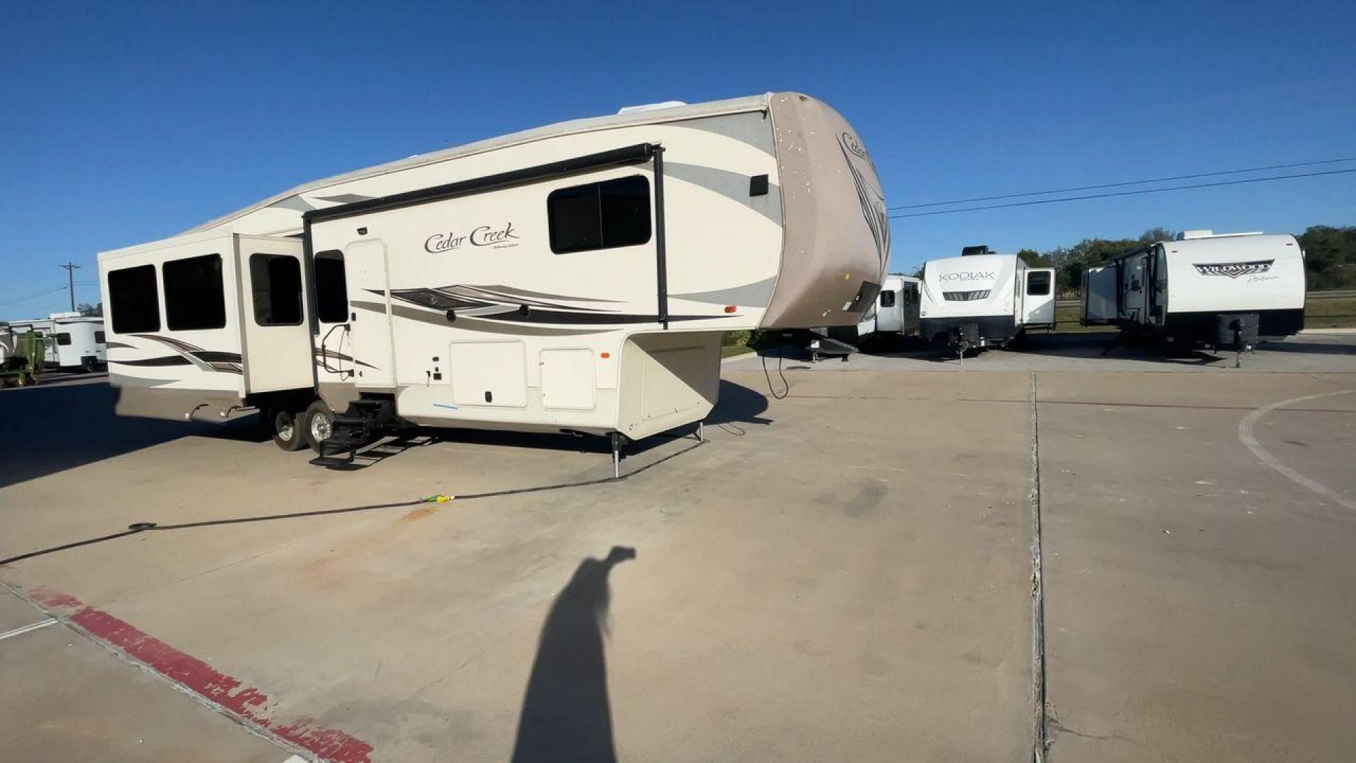 2016 FOREST RIVER CEDAR CREEK 36CKTS - (4X4FCRM24GS) , Length: 39.83 ft. | Dry Weight: 12,670 lbs. | Gross Weight: 16,407 lbs. | Slides: 3 transmission, located at 4319 N Main Street, Cleburne, TX, 76033, (817) 221-0660, 32.435829, -97.384178 - RV Depot in Cleburne, TX is offering a fantastic deal on a 2016 Forest River Cedar Creek 36KTS fifth wheel rear living vehicle. Priced at just $53,995, this luxurious RV is perfect for those looking to hit the open road and explore the local driving highlights around Cleburne, TX. Located in Clebur - Photo#3