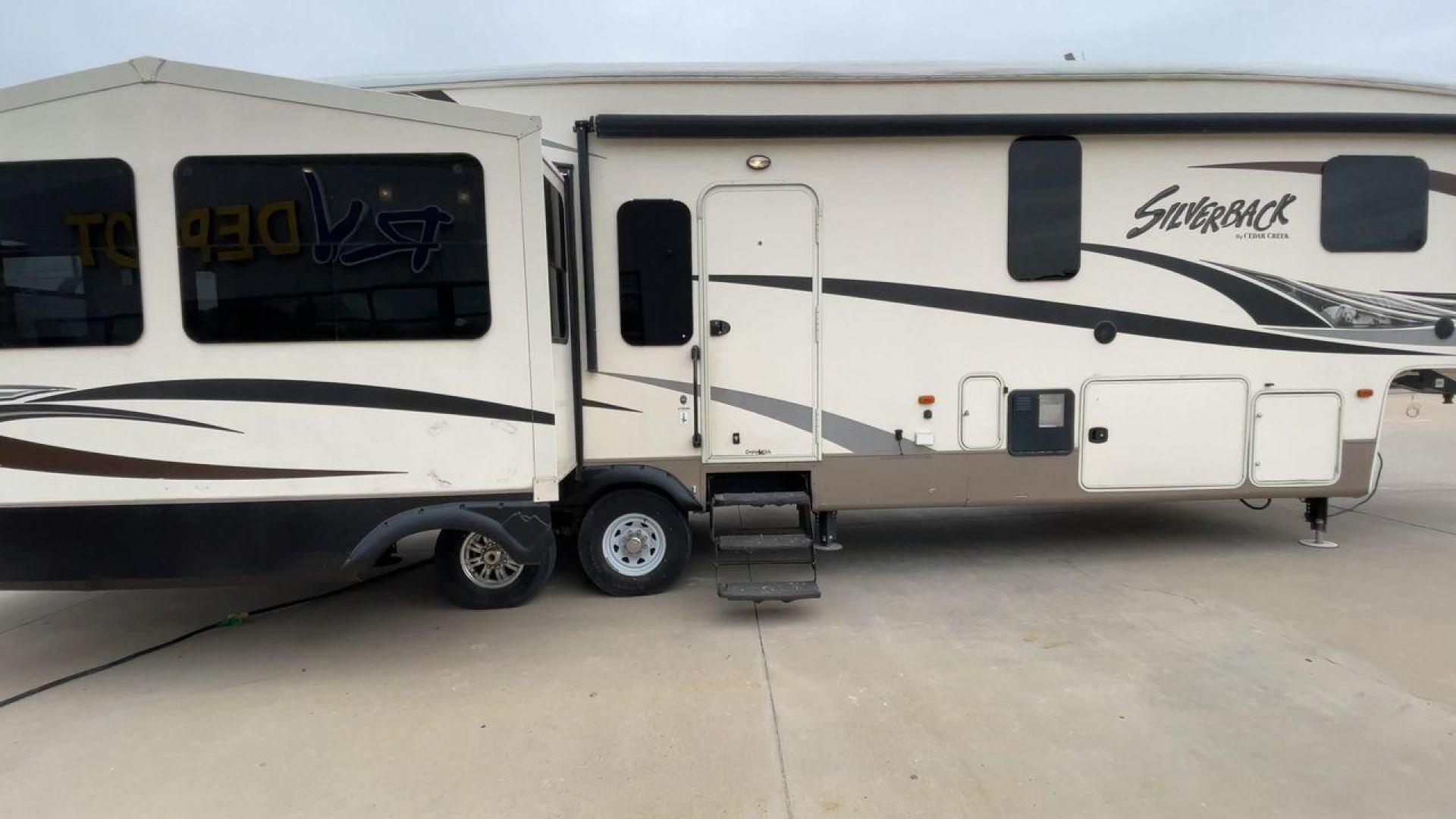 2016 BEIGE FOREST RIVER CEDAR CREEK SILVERBA - (4X4FCRN29GS) , Length: 42.17 ft. | Dry Weight: 12,620 lbs. | Gross Weight: 16,135 lbs. | Slides: 4 transmission, located at 4319 N Main Street, Cleburne, TX, 76033, (817) 221-0660, 32.435829, -97.384178 - This 2016 Forest River Fifth Wheel measures in at just over 42 feet long and 8 feet wide with a dry weight of 12,620 lbs. It has a GVWR of 16,135 lbs and a hitch weight of 2,135 lbs. It also comes with automatic heating and cooling rated at 40,000 and 15,000 BTUs respectively. The exterior of this u - Photo#2