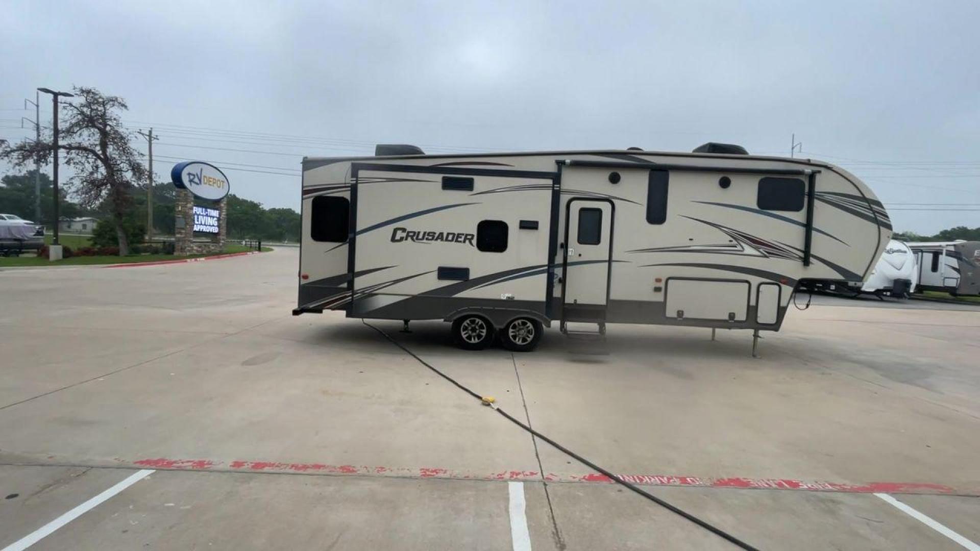 2016 TAN FOREST RIVER CRUSADER 315 (5ZT3CSXB8GG) , Length: 33.92 ft. | Dry Weight: 9,926 lbs. | Gross Weight: 12,353 lbs. | Slides: 3 transmission, located at 4319 N Main Street, Cleburne, TX, 76033, (817) 221-0660, 32.435829, -97.384178 - This 2016 Forest River Crusader 315 fifth wheel has dimensions of 33.92 ft in length, 8 ft in width, and 12.5 ft in height. It has a dry weight of 9,926 lbs, a payload capacity of 2,427 lbs. The GVWR is 12,353 lbs, and the hitch weight is 1,953 lbs. This fifth wheel has an aluminum body material and - Photo#2