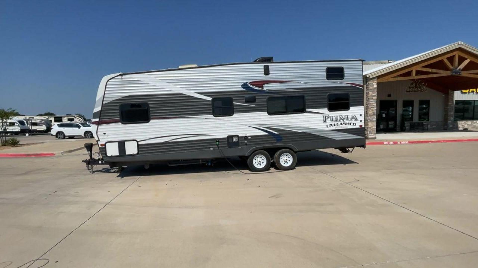 2016 FOREST RIVER PUMA UNLEASHED 25TFS (4X4TPTA27GP) , Length: 29.67 ft. | Dry Weight: 6,991 lbs. | Gross Weight: 9,939 lbs. | Slides: 0 transmission, located at 4319 N Main Street, Cleburne, TX, 76033, (817) 221-0660, 32.435829, -97.384178 - This 2016 Forest River Puma Unleashed 25TFS measures just under 30 feet long. It has a dry weight of 6,991 lbs. and a GVWR of 9,939 lbs. It comes equipped with automatic heating and cooling rated at 30,000 and 13,500 BTUs respectively. It is also designed with a 14-foot power awning. This toy hau - Photo#6