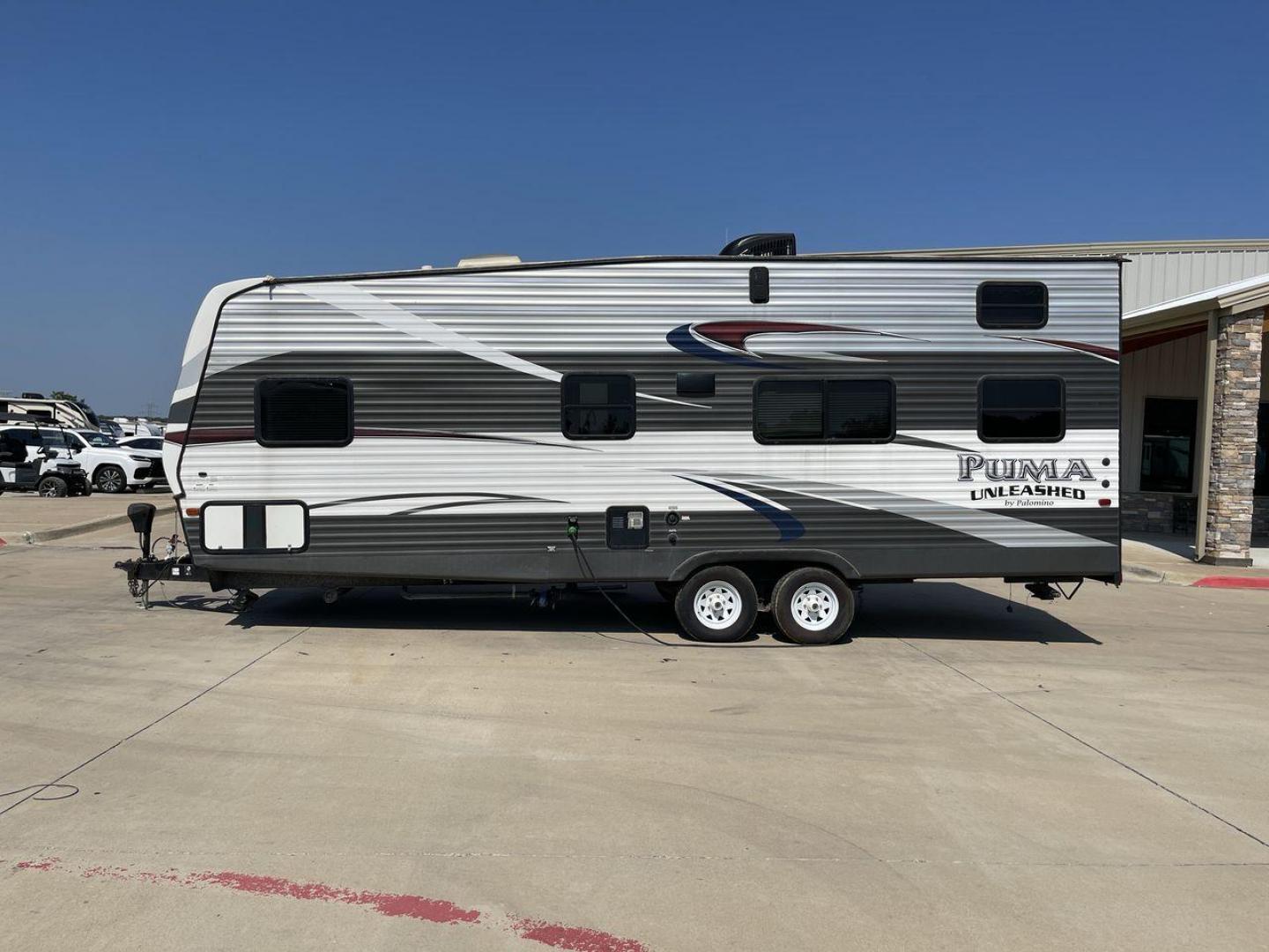 2016 FOREST RIVER PUMA UNLEASHED 25TFS (4X4TPTA27GP) , Length: 29.67 ft. | Dry Weight: 6,991 lbs. | Gross Weight: 9,939 lbs. | Slides: 0 transmission, located at 4319 N Main Street, Cleburne, TX, 76033, (817) 221-0660, 32.435829, -97.384178 - This 2016 Forest River Puma Unleashed 25TFS measures just under 30 feet long. It has a dry weight of 6,991 lbs. and a GVWR of 9,939 lbs. It comes equipped with automatic heating and cooling rated at 30,000 and 13,500 BTUs respectively. It is also designed with a 14-foot power awning. This toy hau - Photo#24