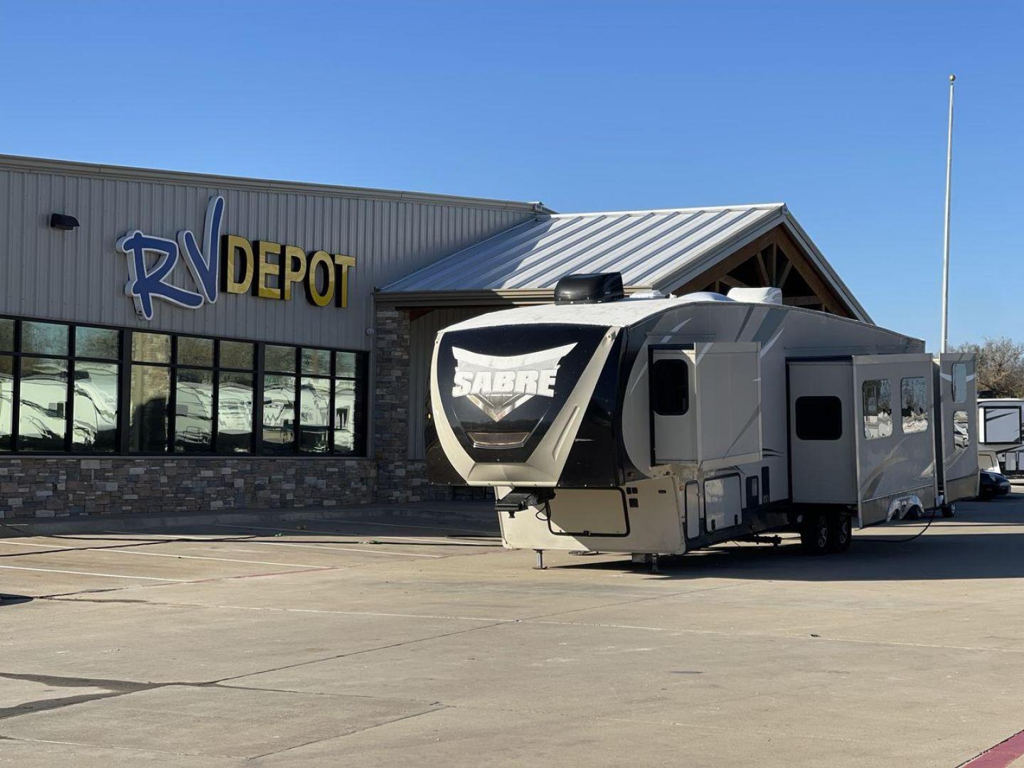 2016 BROWN FOREST RIVER SABRE 360QB (4X4FSRM26G3) , Length: 41.83 ft. | Dry Weight: 12,264 lbs. | Gross Weight: 15,500 lbs. | Slides: 4 transmission, located at 4319 N Main Street, Cleburne, TX, 76033, (817) 221-0660, 32.435829, -97.384178 - The 2016 Forest River Sabre 360QB fifth wheel features a cream-colored finish accented with bold, modern graphics, giving it a contemporary and appealing look. The aerodynamic front cap is designed for improved towing performance and aesthetics. This unit is equipped with four large slideouts that s - Photo#0