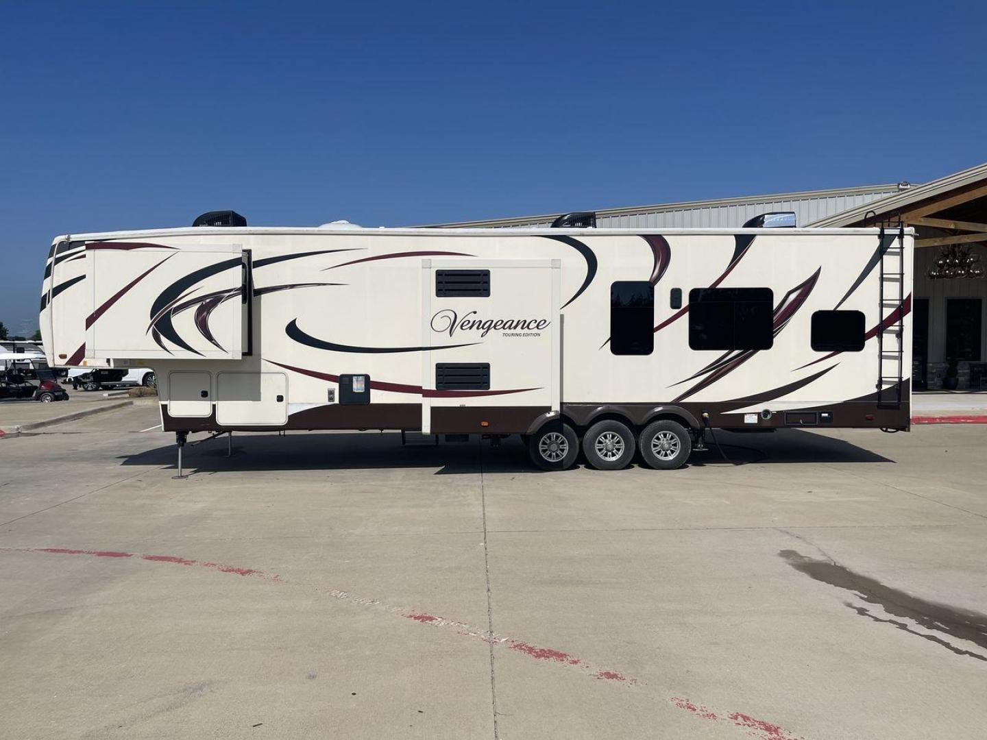 2016 FOREST RIVER VENGEANCE 38L12 (4X4FVGP36GR) , Length: 42.83 ft | Dry Weight: 14,814 lbs | Gross Weight: 18,000 lbs | Slides: 3 transmission, located at 4319 N Main Street, Cleburne, TX, 76033, (817) 221-0660, 32.435829, -97.384178 - The 2016 Forest River Vengeance 38L12 is a luxury fifth-wheel toy hauler that provides a spacious and comfortable living area for all of your activities. With a length of roughly 42.83 feet and a dry weight of 14,814 pounds, this RV offers enough space and durability to meet your demands. With an al - Photo#28