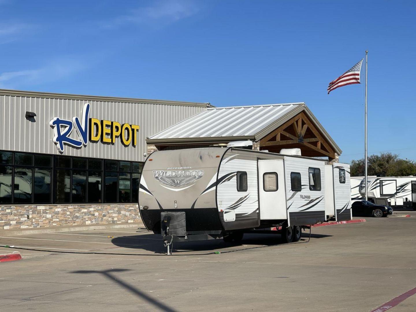 2016 FOREST RIVER WILDWOOD 32BHDS (4X4TWDH24GA) , Length: 35.67 ft. | Dry Weight: 7,955 lbs. | Slides: 2 transmission, located at 4319 N Main Street, Cleburne, TX, 76033, (817) 221-0660, 32.435829, -97.384178 - Reasons to buy this RV include: (1) It has two slide-out sections that offer more room to move around, relax, and dine comfortably compared to a non-slide trailer. (2) It offers convenient dual entry doors that create separate entry points for different areas of the RV. (3) It features a bunkhou - Photo#0