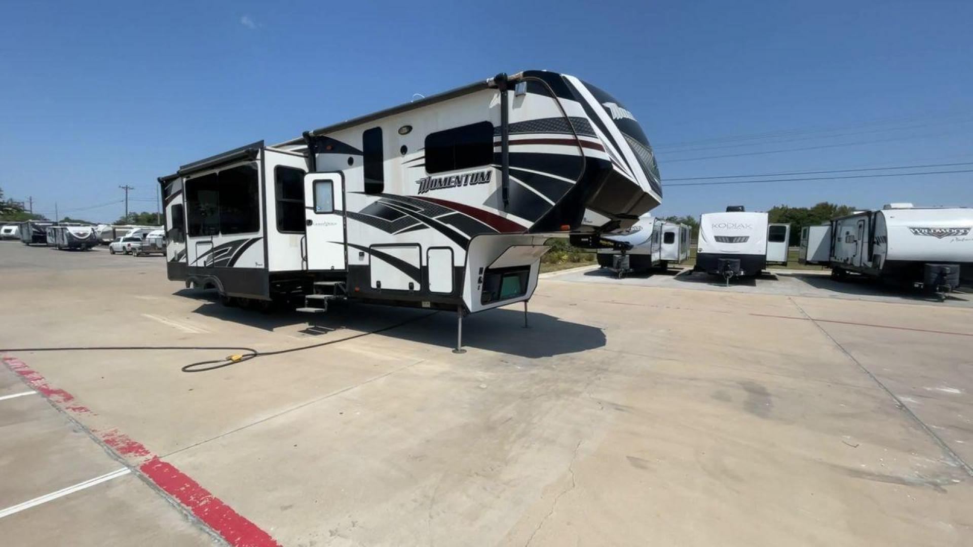 2016 GRAND DESIGN MOMENTUM 397TH (573FM4530G1) , Length: 43.25 ft. | Dry Weight: 15,500 lbs. | Gross Weight: 19,500 lbs. | Slides: 3 transmission, located at 4319 N Main Street, Cleburne, TX, 76033, (817) 221-0660, 32.435829, -97.384178 - Photo#3