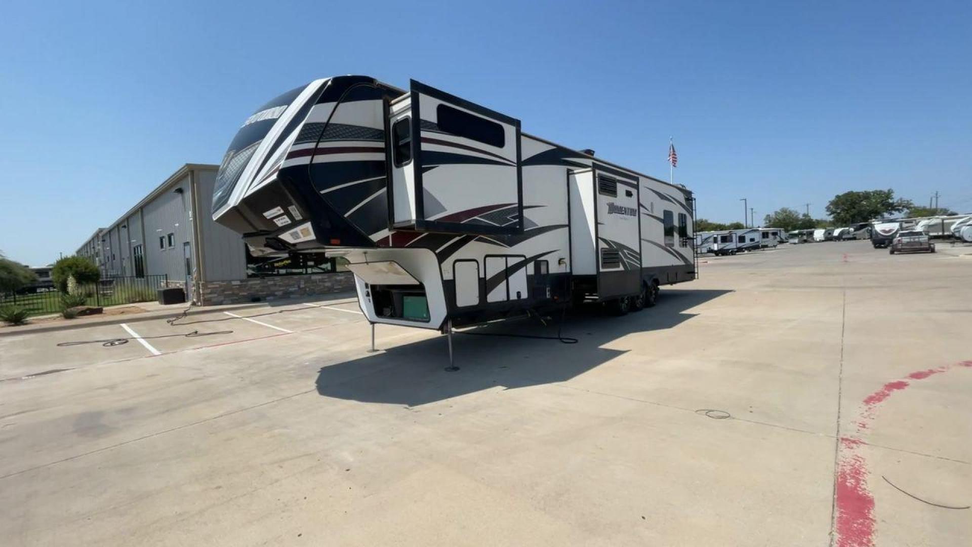 2016 GRAND DESIGN MOMENTUM 397TH (573FM4530G1) , Length: 43.25 ft. | Dry Weight: 15,500 lbs. | Gross Weight: 19,500 lbs. | Slides: 3 transmission, located at 4319 N Main Street, Cleburne, TX, 76033, (817) 221-0660, 32.435829, -97.384178 - Photo#5