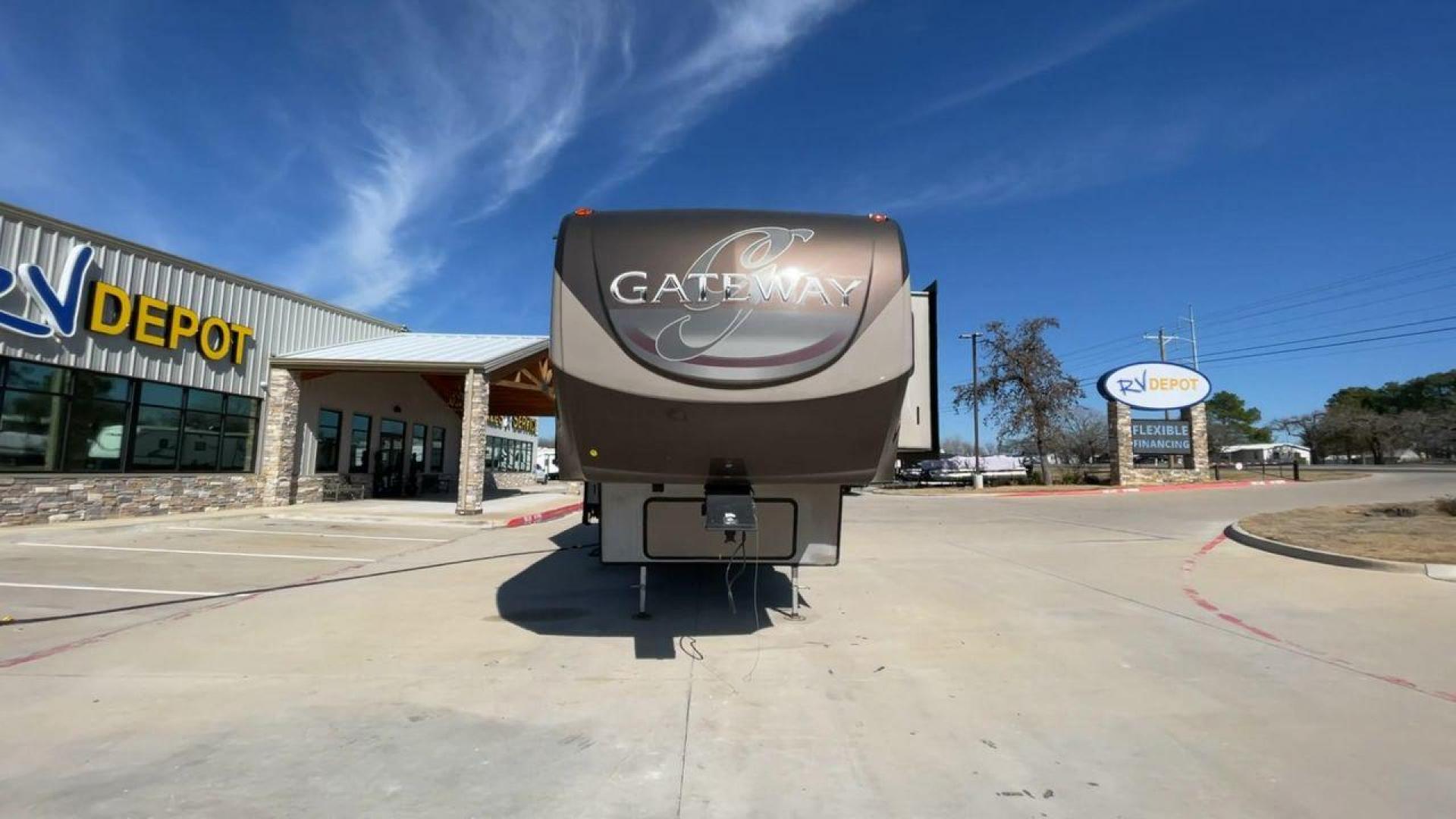 2016 HEARTLAND GATEWAY 3400SE (5SFSG3728GE) , Length: 36.7 ft. | Dry Weight: 11,724 lbs. | Gross Weight: 14,000 lbs. | Slides: 3 transmission, located at 4319 N Main Street, Cleburne, TX, 76033, (817) 221-0660, 32.435829, -97.384178 - Presenting the 2016 Heartland Gateway 3400SE—a travel trailer that sets a new standard for comfortable and stylish camping. With its ideal length, this model offers a comfortable getaway for solo travelers or families. The unit boasts a rear roof access, providing a unique vantage point to admire - Photo#4