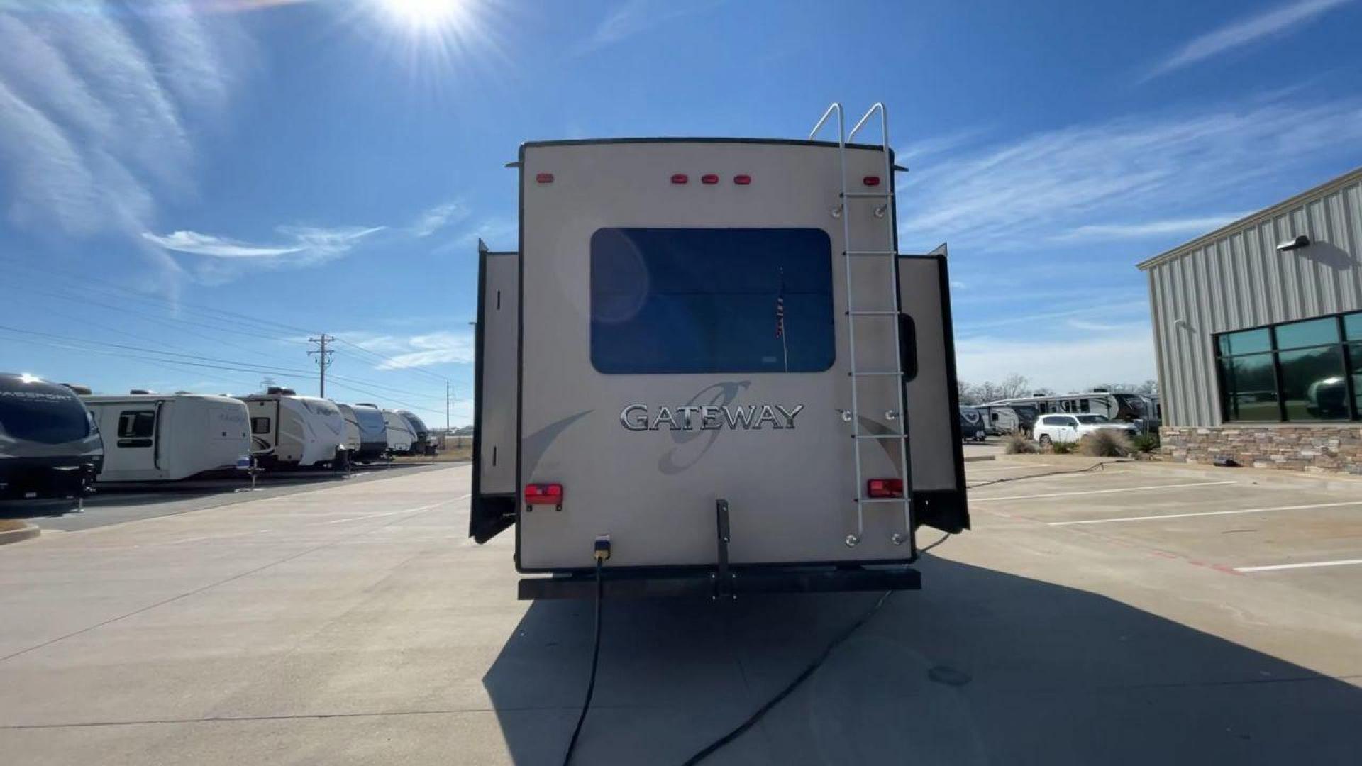 2016 HEARTLAND GATEWAY 3400SE (5SFSG3728GE) , Length: 36.7 ft. | Dry Weight: 11,724 lbs. | Gross Weight: 14,000 lbs. | Slides: 3 transmission, located at 4319 N Main Street, Cleburne, TX, 76033, (817) 221-0660, 32.435829, -97.384178 - Presenting the 2016 Heartland Gateway 3400SE—a travel trailer that sets a new standard for comfortable and stylish camping. With its ideal length, this model offers a comfortable getaway for solo travelers or families. The unit boasts a rear roof access, providing a unique vantage point to admire - Photo#8