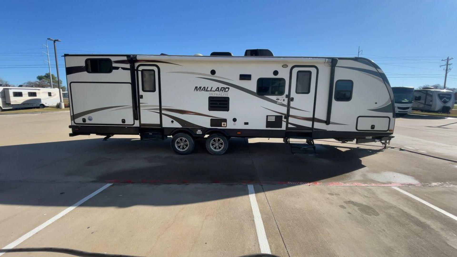 2016 HEARTLAND MALLARD M32 (5SFNB3423GE) , Length: 34.7 ft. | Dry Weight: 6,700 lbs. | Gross Weight: 8,600 lbs. | Slides: 2 transmission, located at 4319 N Main Street, Cleburne, TX, 76033, (817) 221-0660, 32.435829, -97.384178 - "The 2016 Heartland Mallard M32 is a spacious and versatile travel trailer designed to make your camping adventures comfortable and memorable. With a length of 34.7 ft., a width of 8 ft., and a height of 11.33 ft., this unit offers plenty of room for family and friends. It has a dry weight of 6,700 - Photo#2