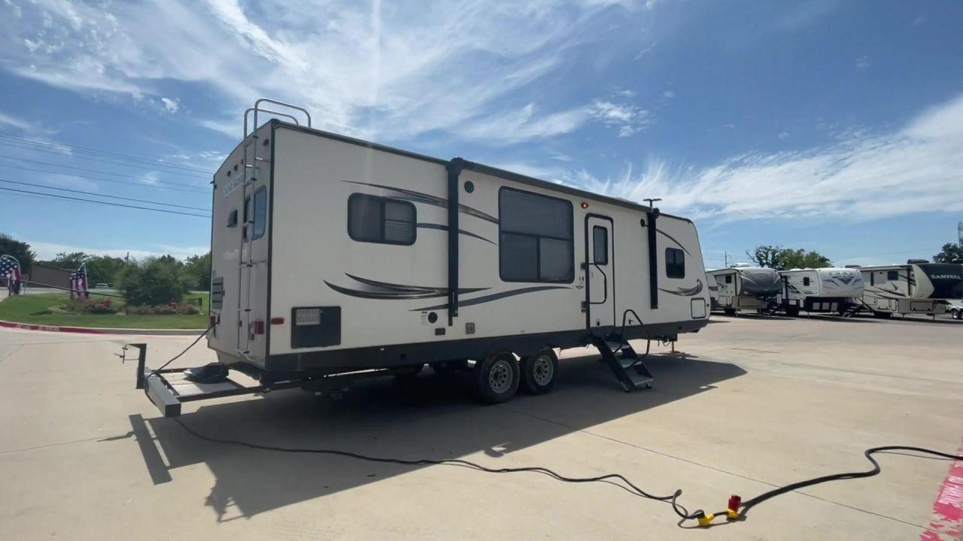 2016 WHITE HEARTLAND TRAIL RUNNER 27RKS (5SFEB3321GE) , Length: 33.4 ft. | Dry Weight: 6,542 lbs. | Gross Weight: 9,000 lbs. | Slides: 1 transmission, located at 4319 N Main Street, Cleburne, TX, 76033, (817) 221-0660, 32.435829, -97.384178 - With the 2016 Heartland Trail Runner 27RKS travel trailer, set out on an adventure-filled and comfortable tour. For those looking for an unforgettable camping experience, this well-designed RV offers the ideal blend of roomy living, contemporary conveniences, and considerate features. The measuremen - Photo#1