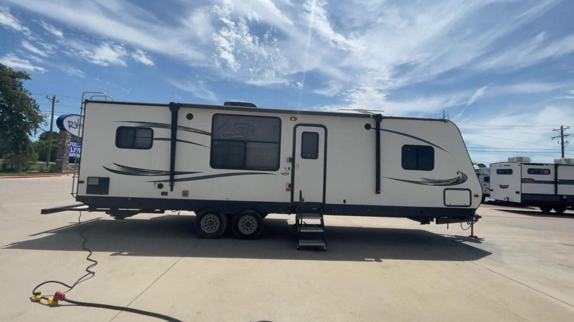 2016 WHITE HEARTLAND TRAIL RUNNER 27RKS (5SFEB3321GE) , Length: 33.4 ft. | Dry Weight: 6,542 lbs. | Gross Weight: 9,000 lbs. | Slides: 1 transmission, located at 4319 N Main Street, Cleburne, TX, 76033, (817) 221-0660, 32.435829, -97.384178 - With the 2016 Heartland Trail Runner 27RKS travel trailer, set out on an adventure-filled and comfortable tour. For those looking for an unforgettable camping experience, this well-designed RV offers the ideal blend of roomy living, contemporary conveniences, and considerate features. The measuremen - Photo#2