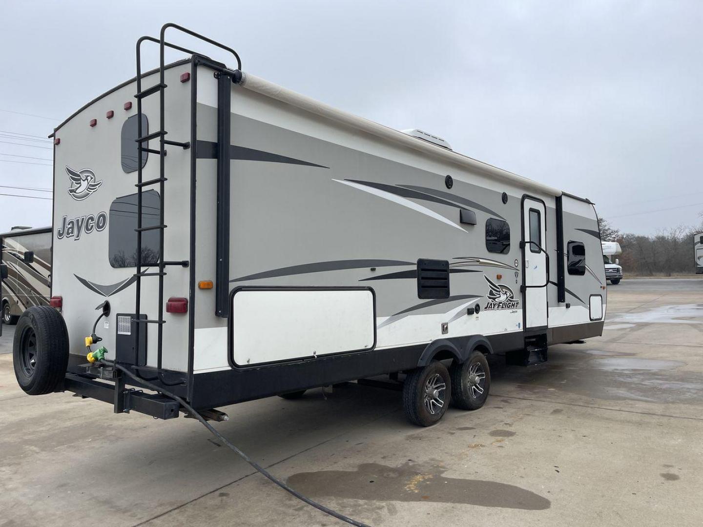 2016 JAYCO JAYFLIGHT 27BH (1UJBJ0BP9G7) , Length: 30 ft | Slides: 1 transmission, located at 4319 N Main Street, Cleburne, TX, 76033, (817) 221-0660, 32.435829, -97.384178 - The 2016 Jayco Jay Flight 27BH is a 30-foot travel trailer built for comfort and adventure. Its exterior features a sleek, aerodynamic front with Jayco’s signature graphics and durable aluminum siding. The single slide expands the living space. The dual-axle design with stylish alloy wheels ensure - Photo#24