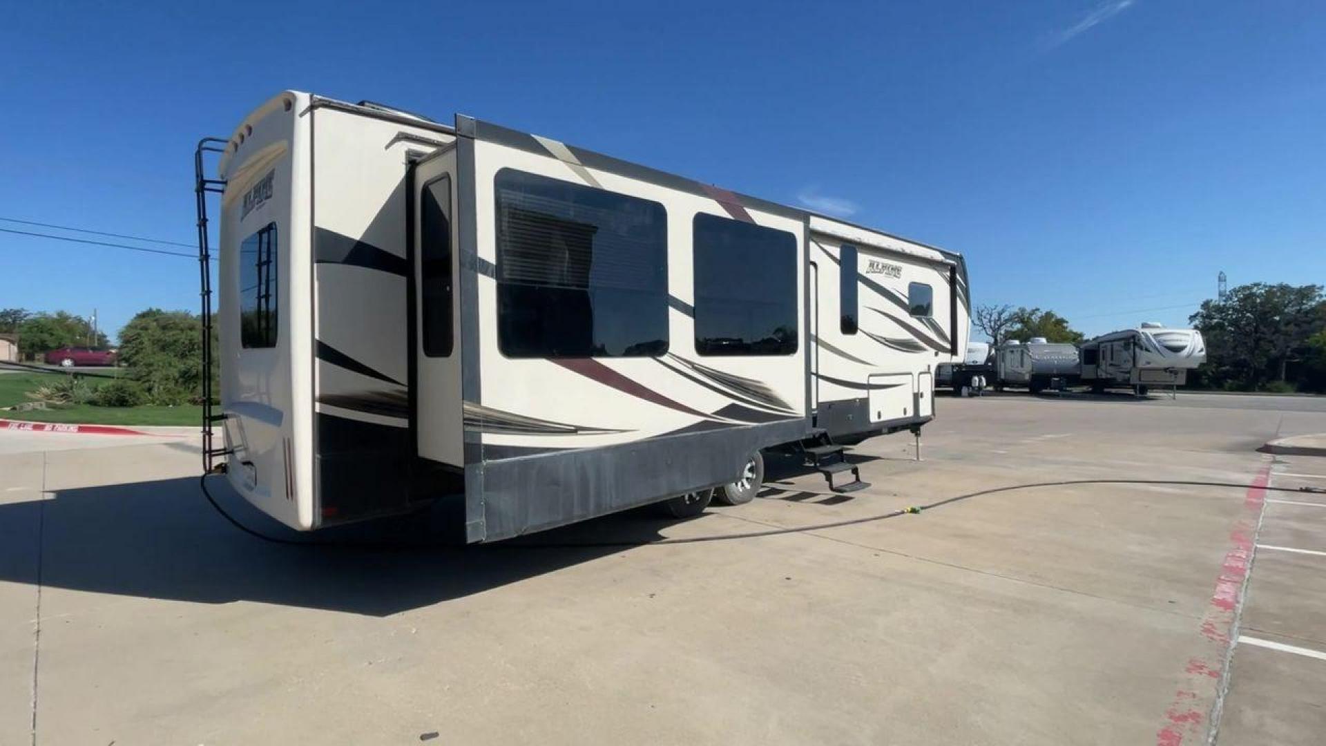 2016 WHITE KEYSTONE ALPINE 3511RE (4YDF35124GE) , Length: 39.17 ft. | Dry Weight: 13,100 lbs. | Gross Weight: 15,500 lbs. | Slides: 4 transmission, located at 4319 N Main Street, Cleburne, TX, 76033, (817) 221-0660, 32.435829, -97.384178 - The 2016 Keystone Alpine 3511RE Fifth Wheel offers a spacious and luxurious home on wheels, measuring 39.17 feet in length. It has a dry weight of 13,100 lbs and a gross weight of 15,500 lbs, making it a solid choice for those looking for both comfort and durability during extended travels. With fou - Photo#1